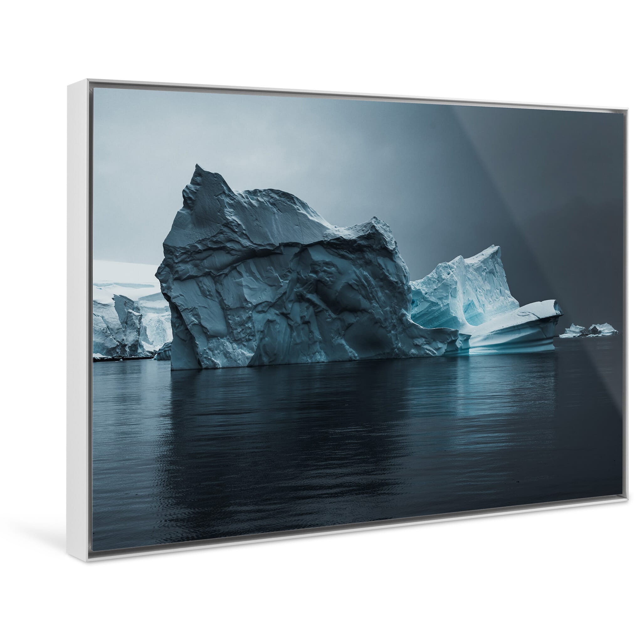 Framed photo print of a massive ice formation shaped by wind and ocean currents