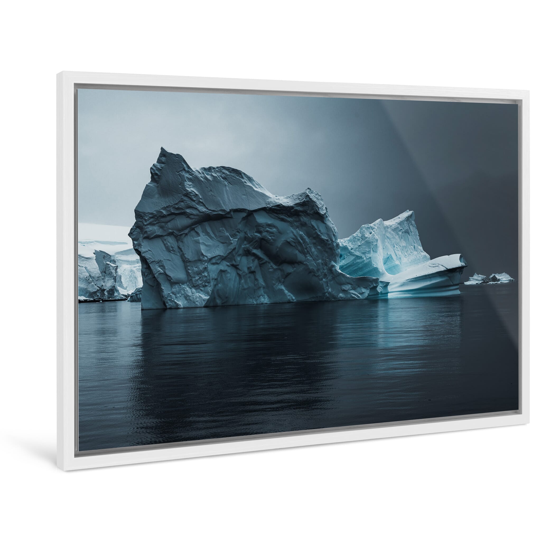 Framed photo print of a moody iceberg scene revealing unique shapes and forms