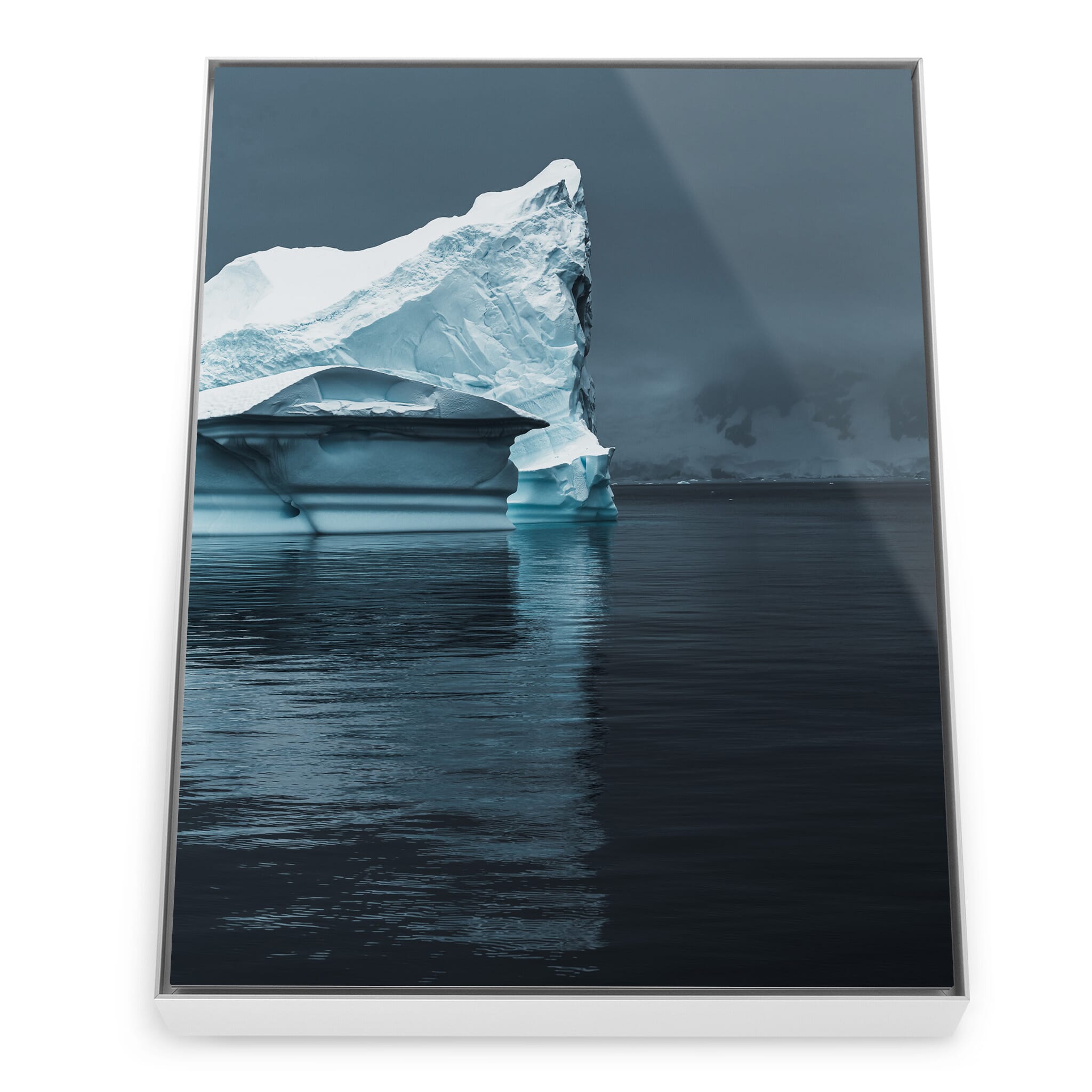 Framed photo print of Antarctic iceberg shaped by wind and waves