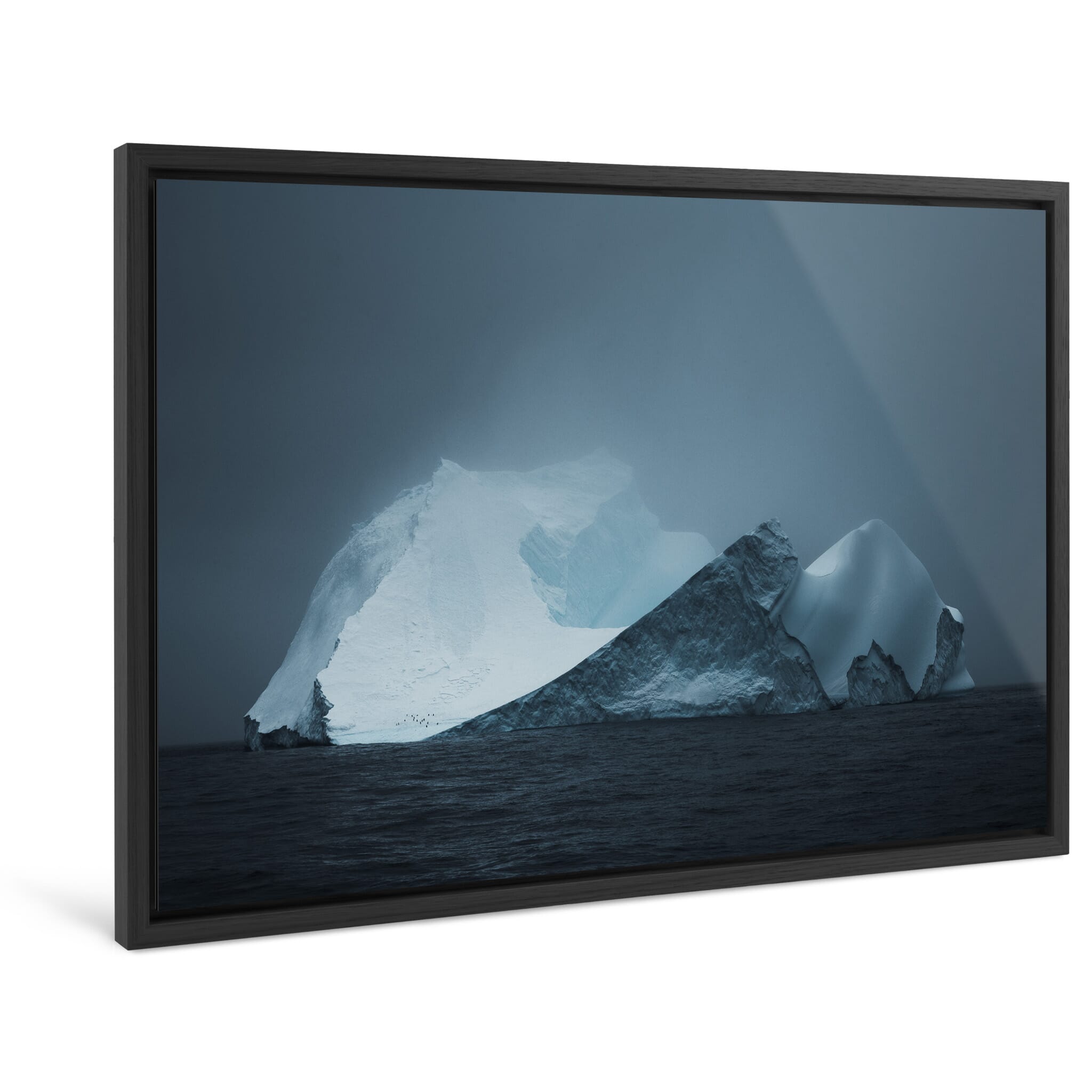 Framed photo print of dark and atmospheric seascape with solitary iceberg