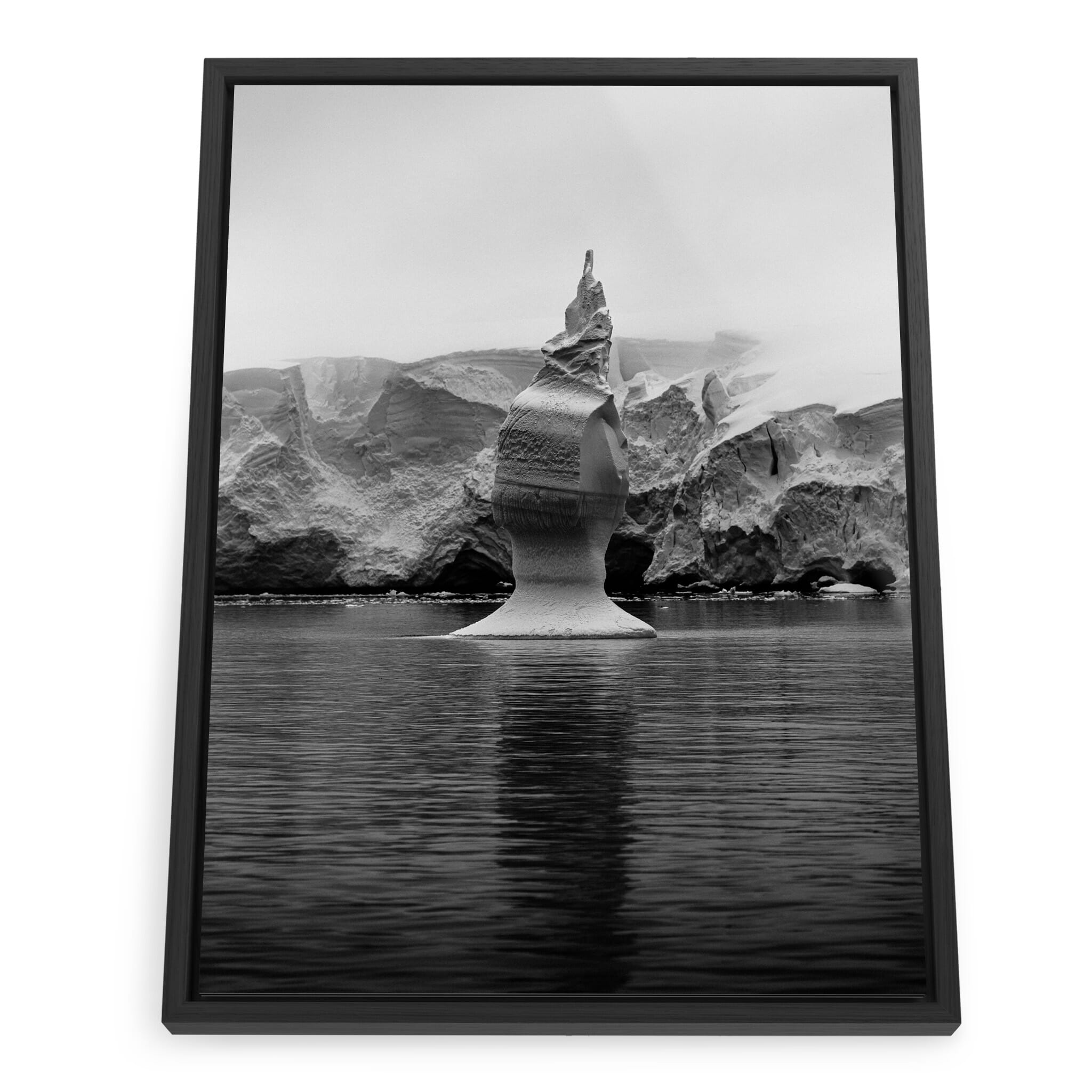 Framed photo print of a single iceberg with glacier background