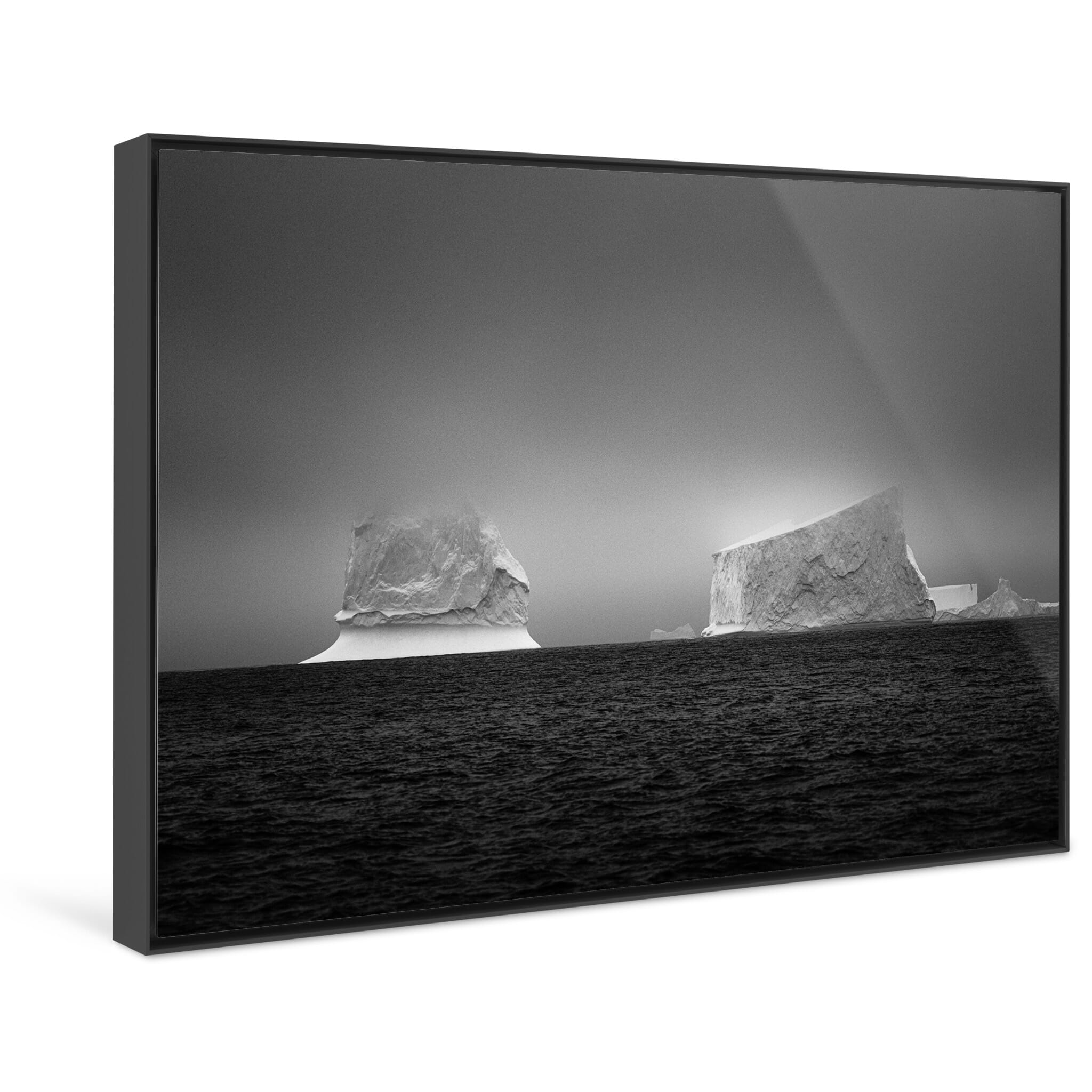 Framed photo print of two icebergs revealing minimal patterns in harsh polar light