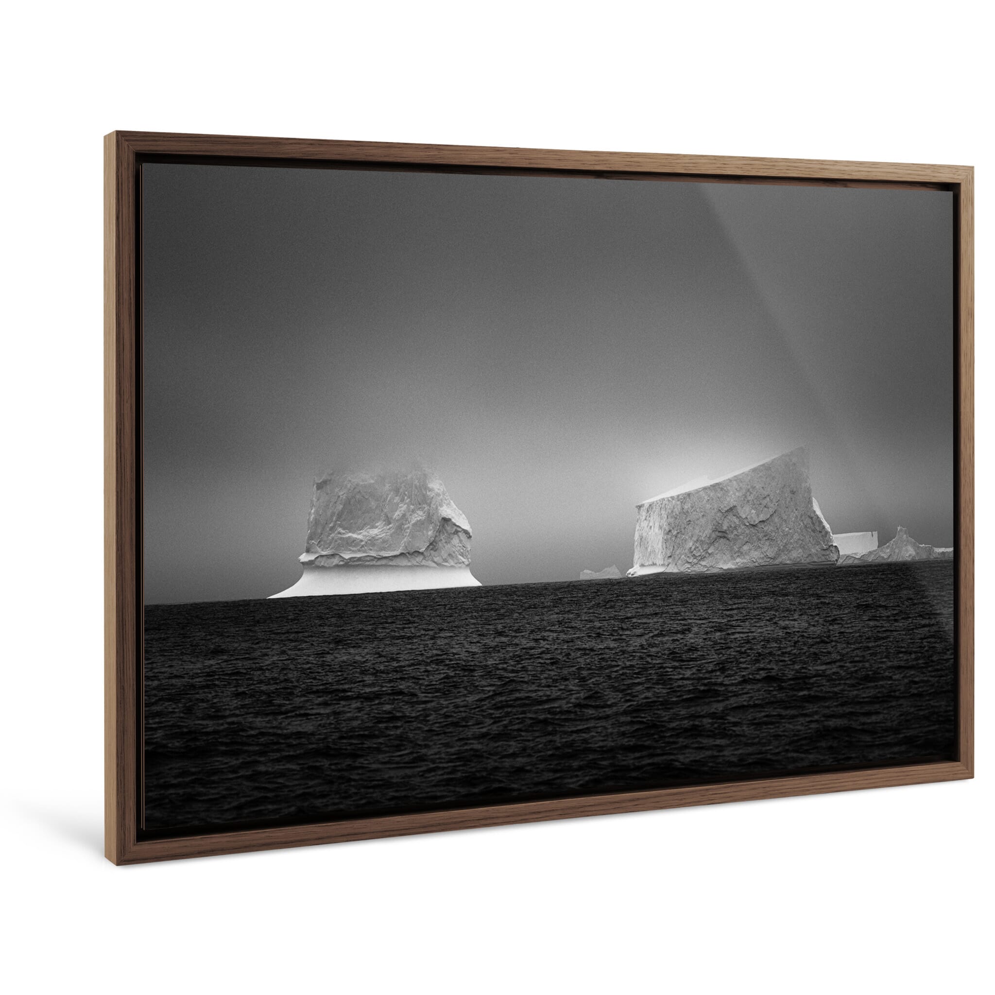 Framed photo print of two icebergs highlighting wind-shaped textures in Antarctica