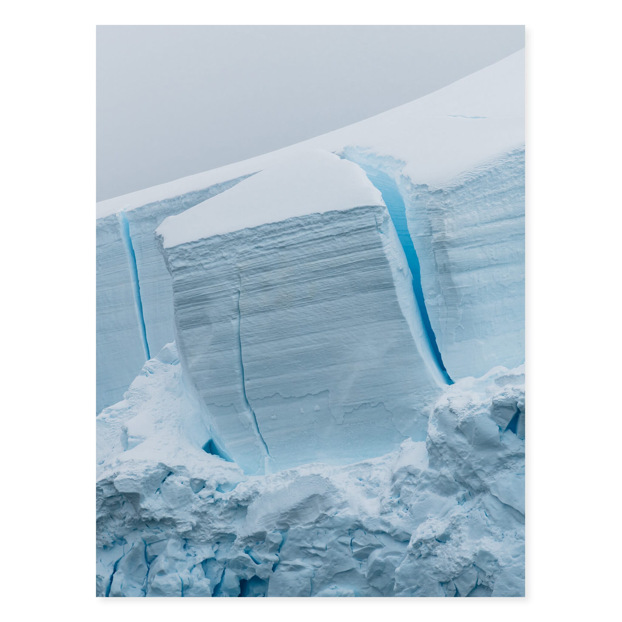 Fine art print of surreal blue ice tones and intricate glacial patterns in Antarctica