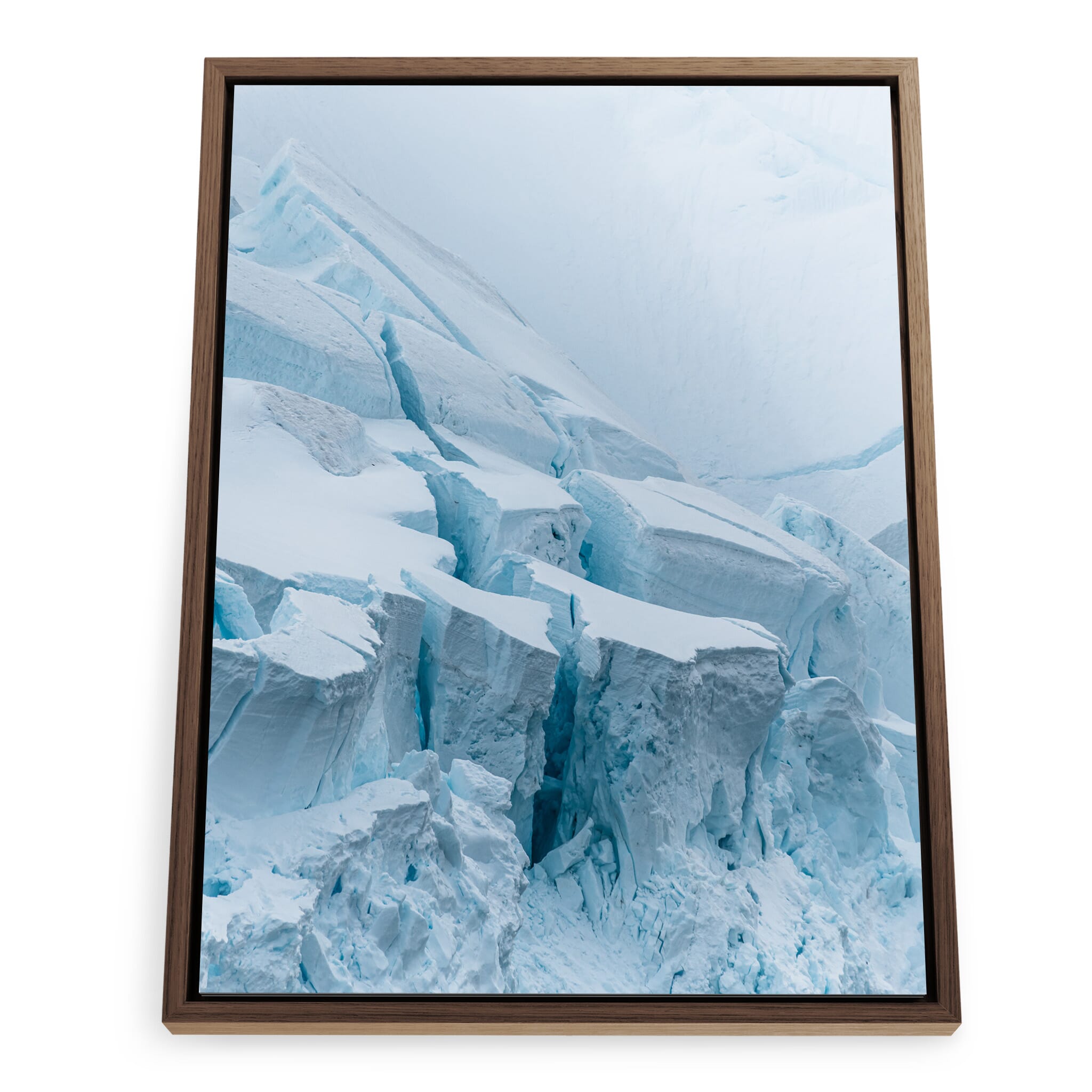 Framed photo print of layered glacial textures with glowing blue highlights