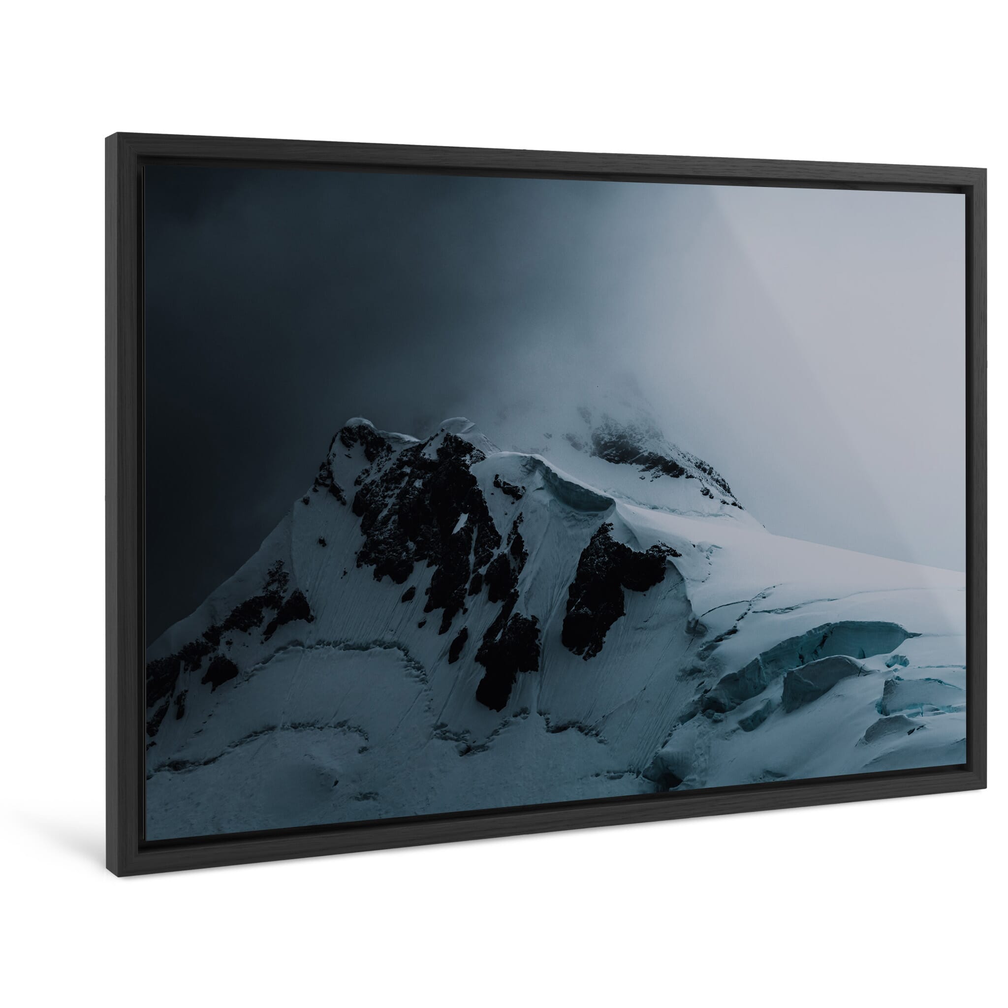 Framed photo print of a dramatic snow-covered peak in Antarctica’s moody light