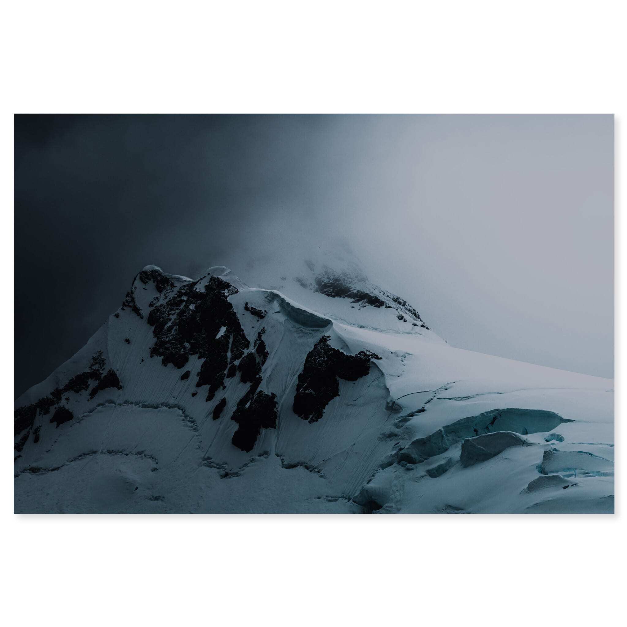Fine art print of a towering Antarctic mountain glacier with clouds at the peak
