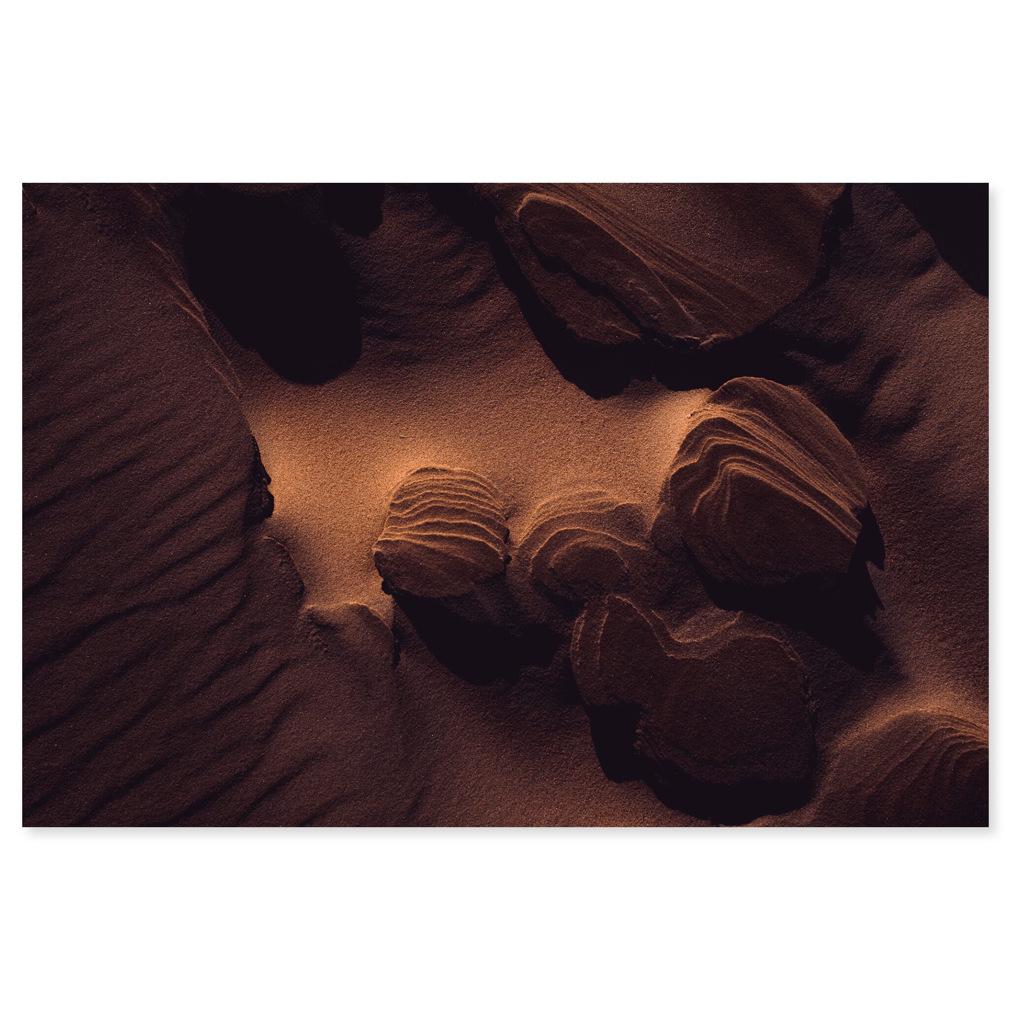 Fine art print of layered sand formations shaped by wind and light