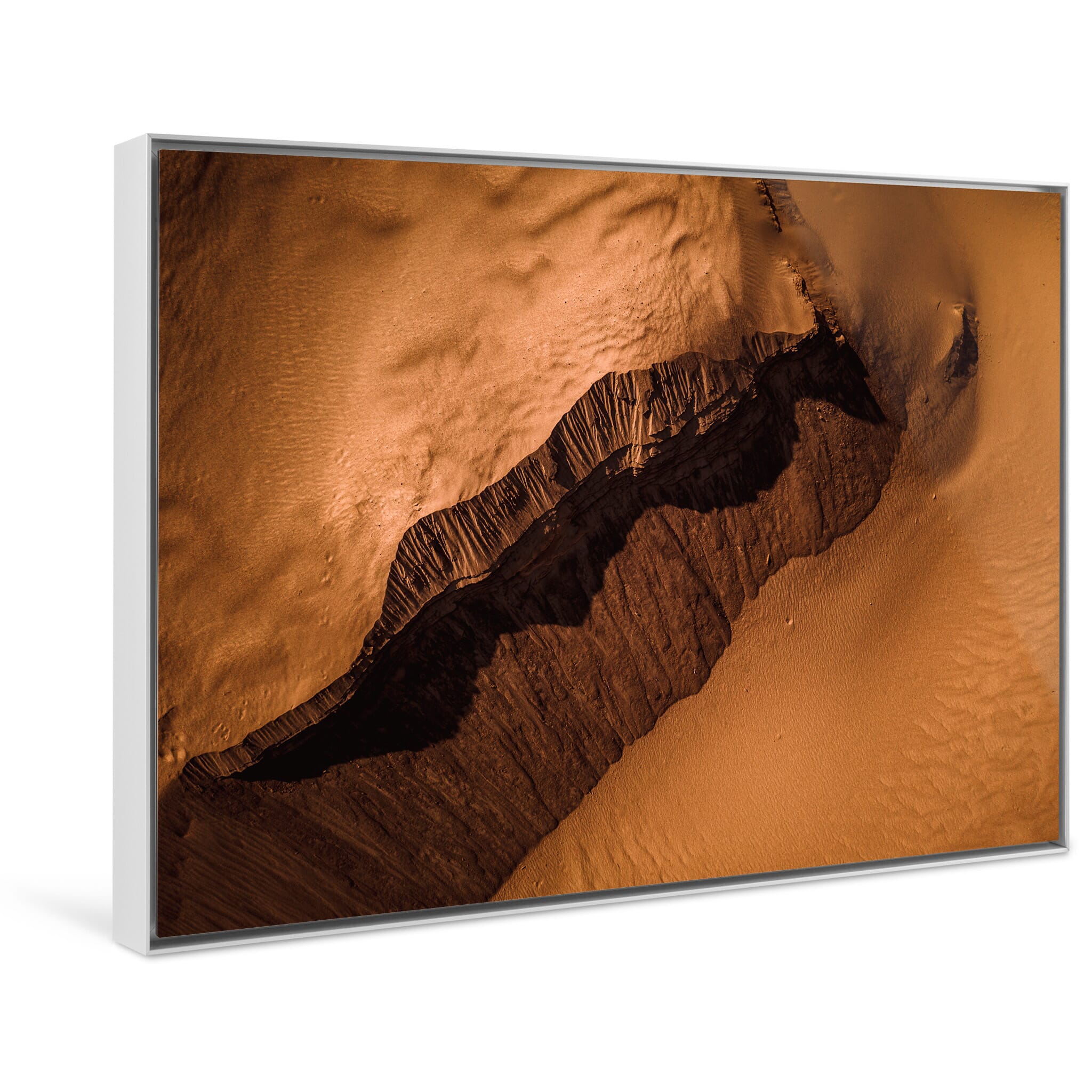 Framed photo print of shifting sand details revealing hidden structures