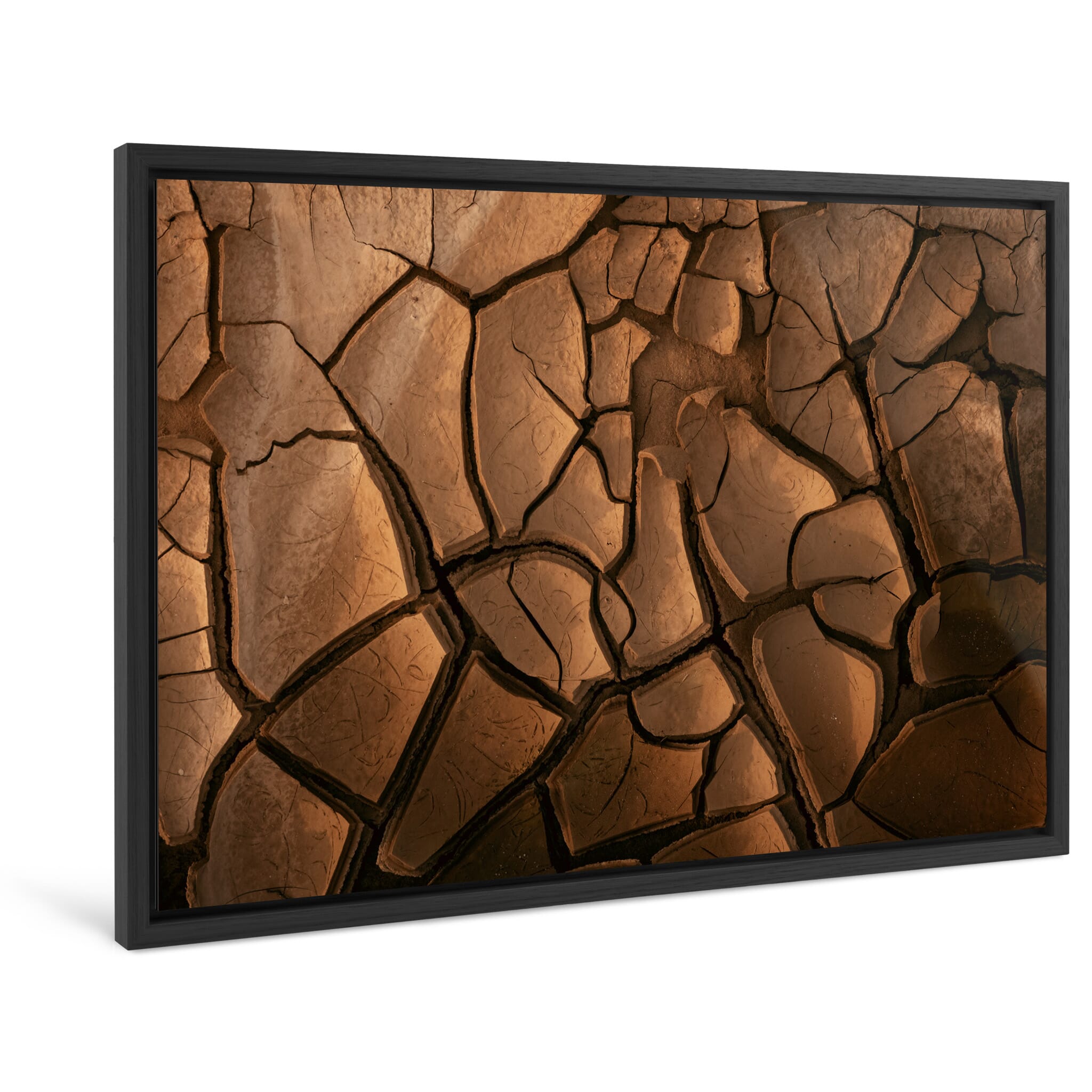 Framed photo print of textured mud with natural cracks and curled edges