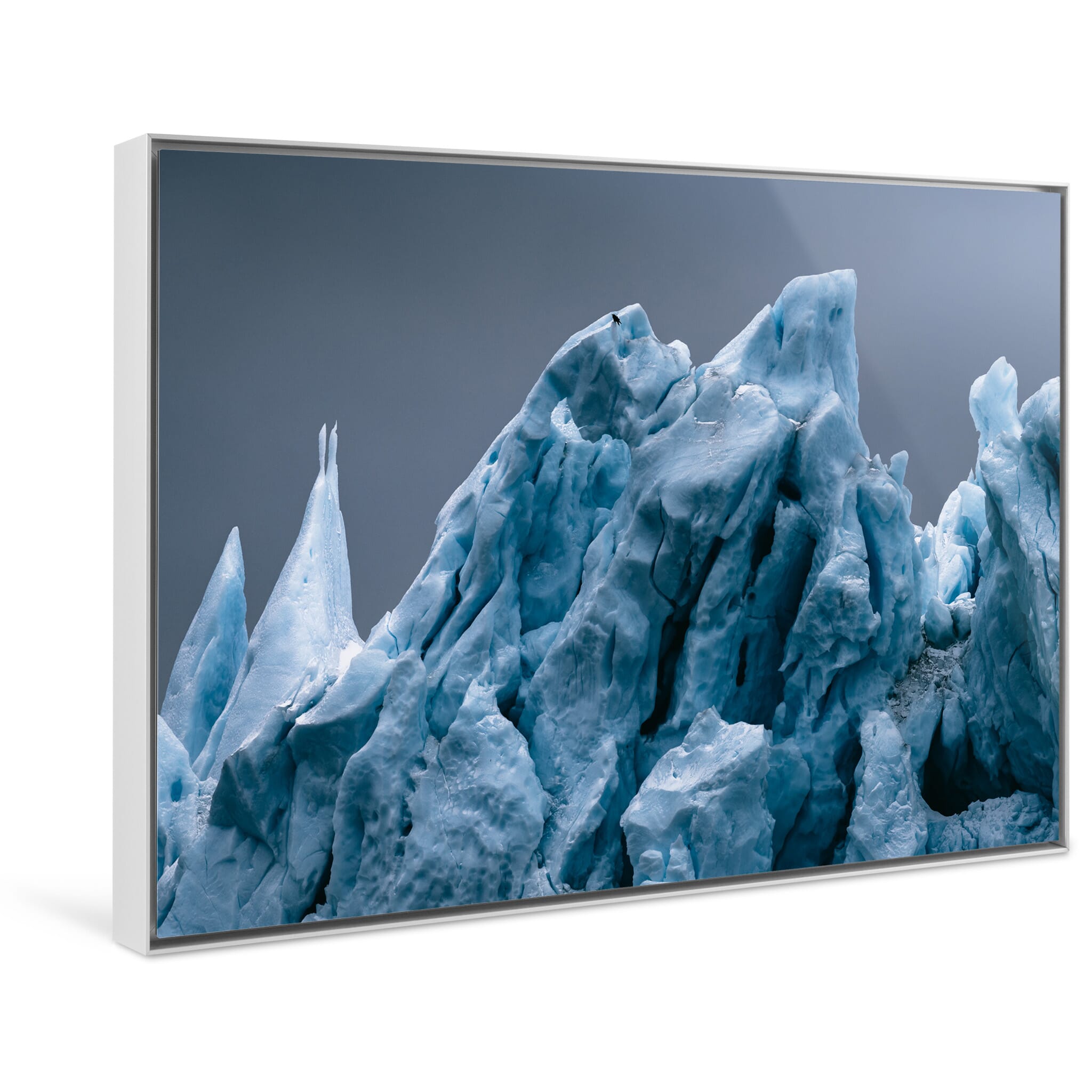 Framed photo print of dramatic iceberg structure in subdued tones