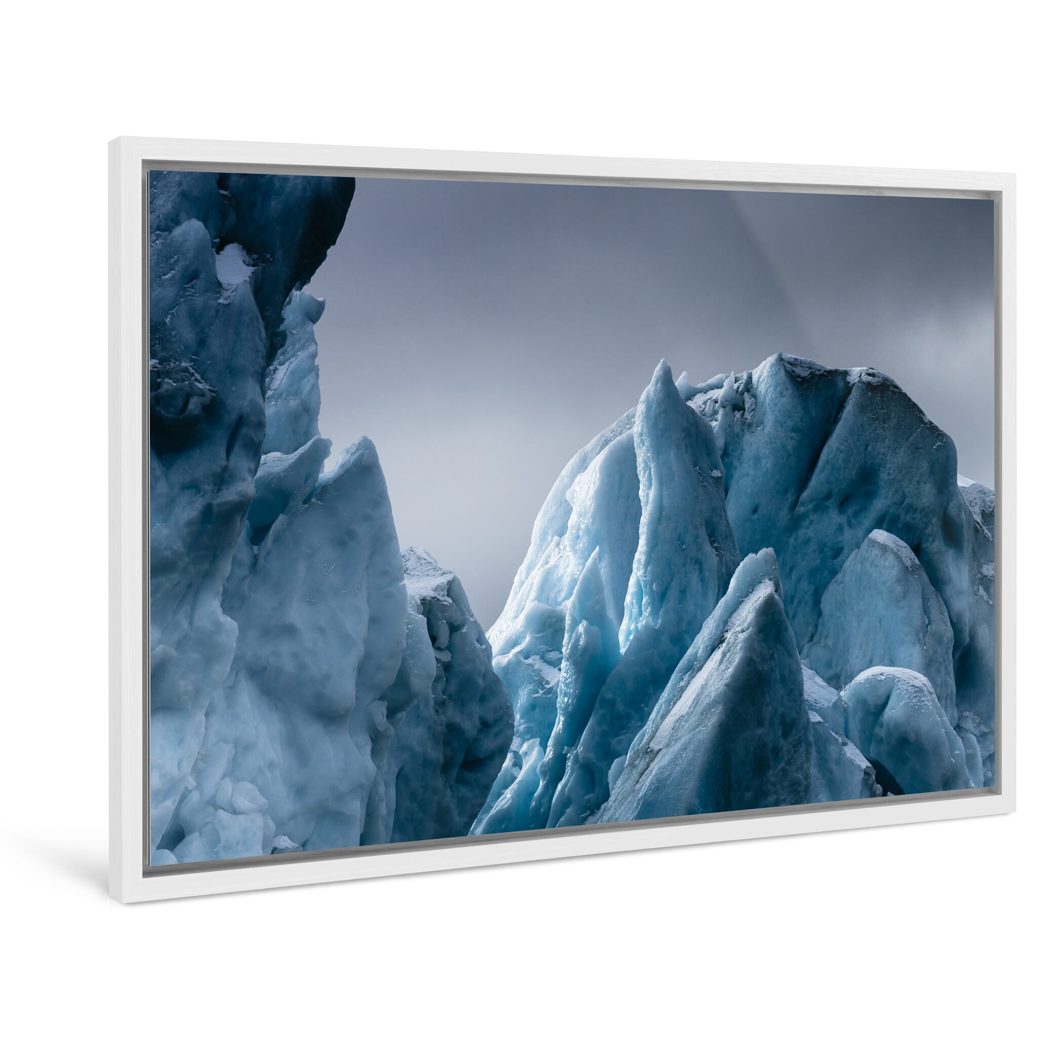 Framed photo print of drifting icebergs in moody winter atmosphere