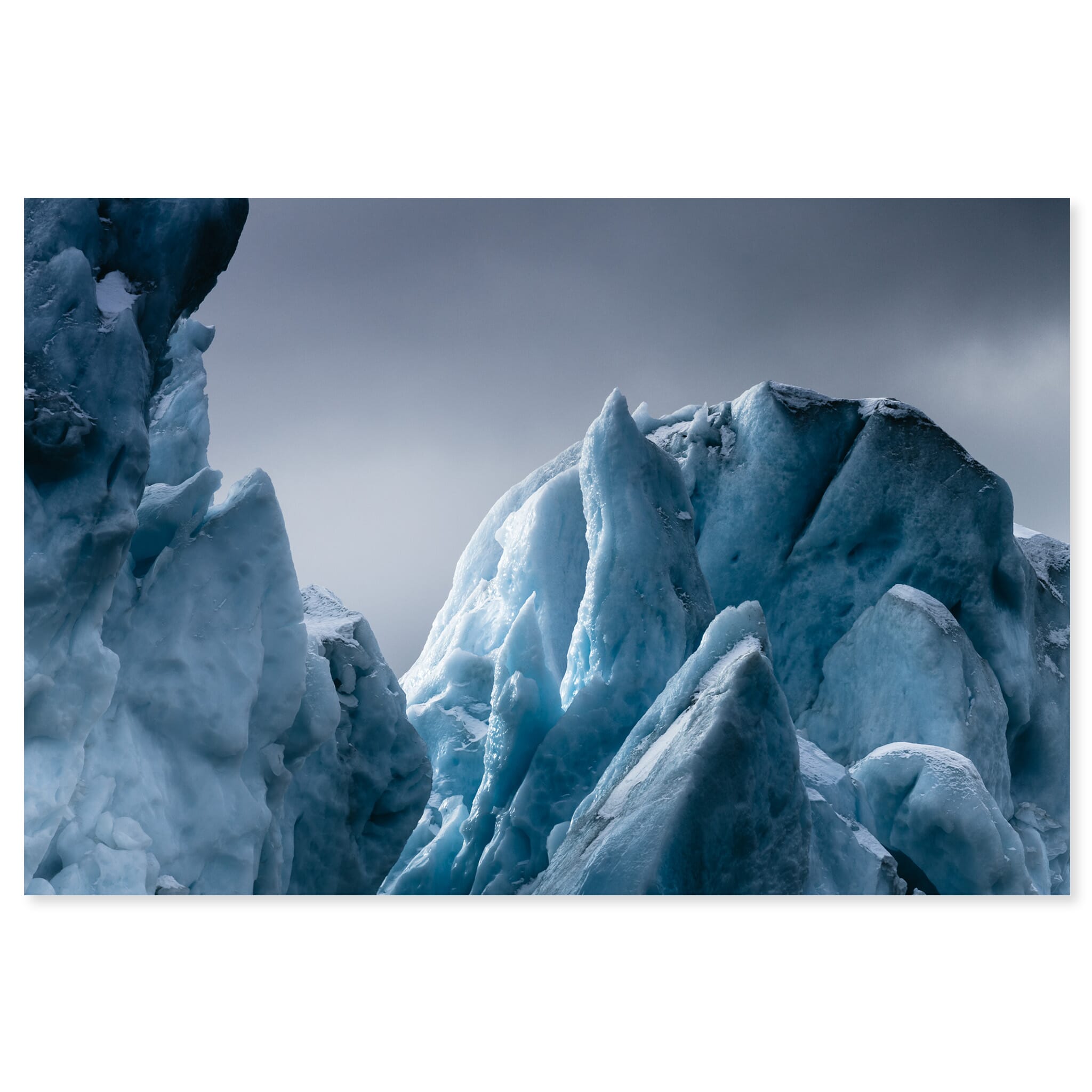 Fine art print of iceberg peaks in Greenland under soft winter light