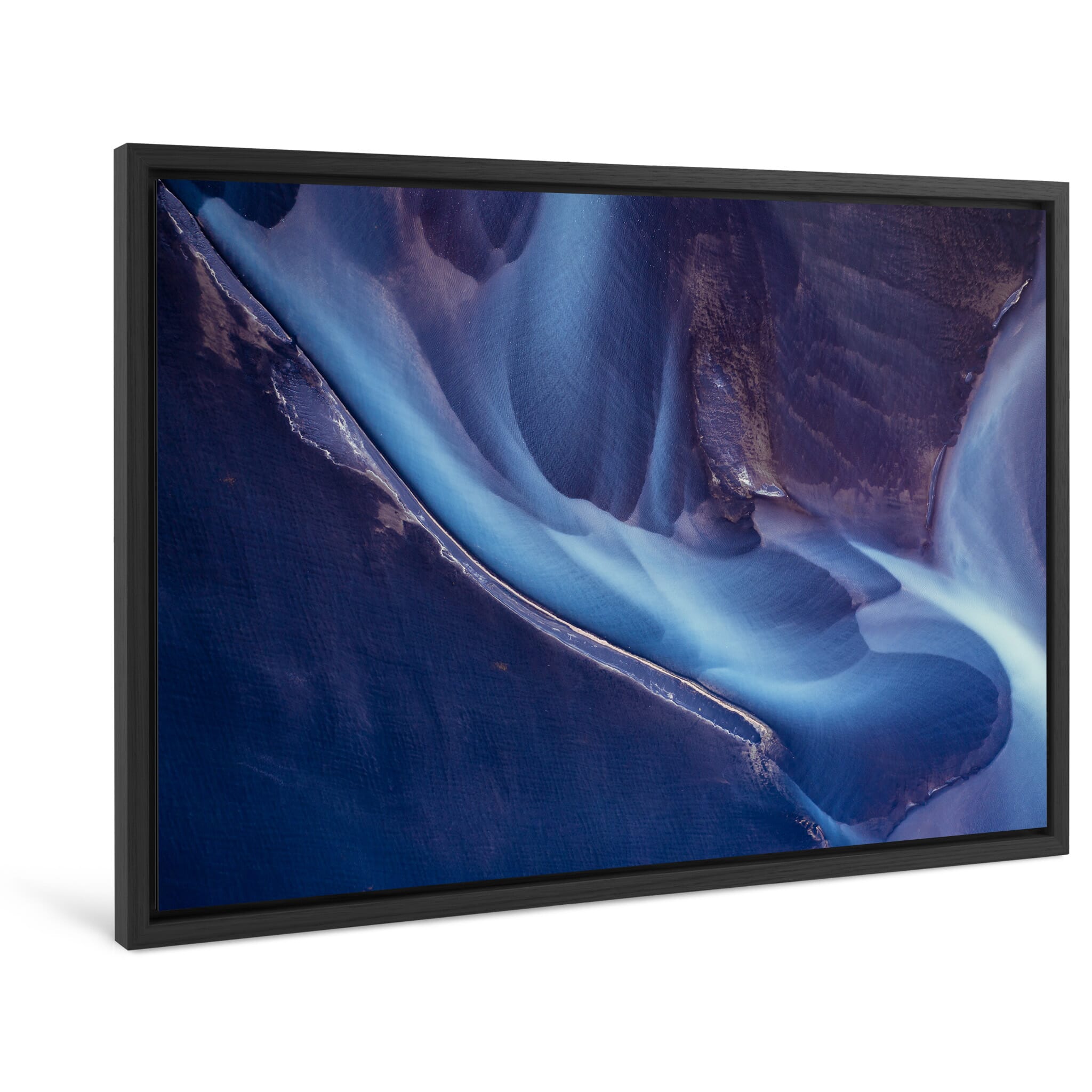 Framed photo print of bright sediment colors shaping a flowing glacial river
