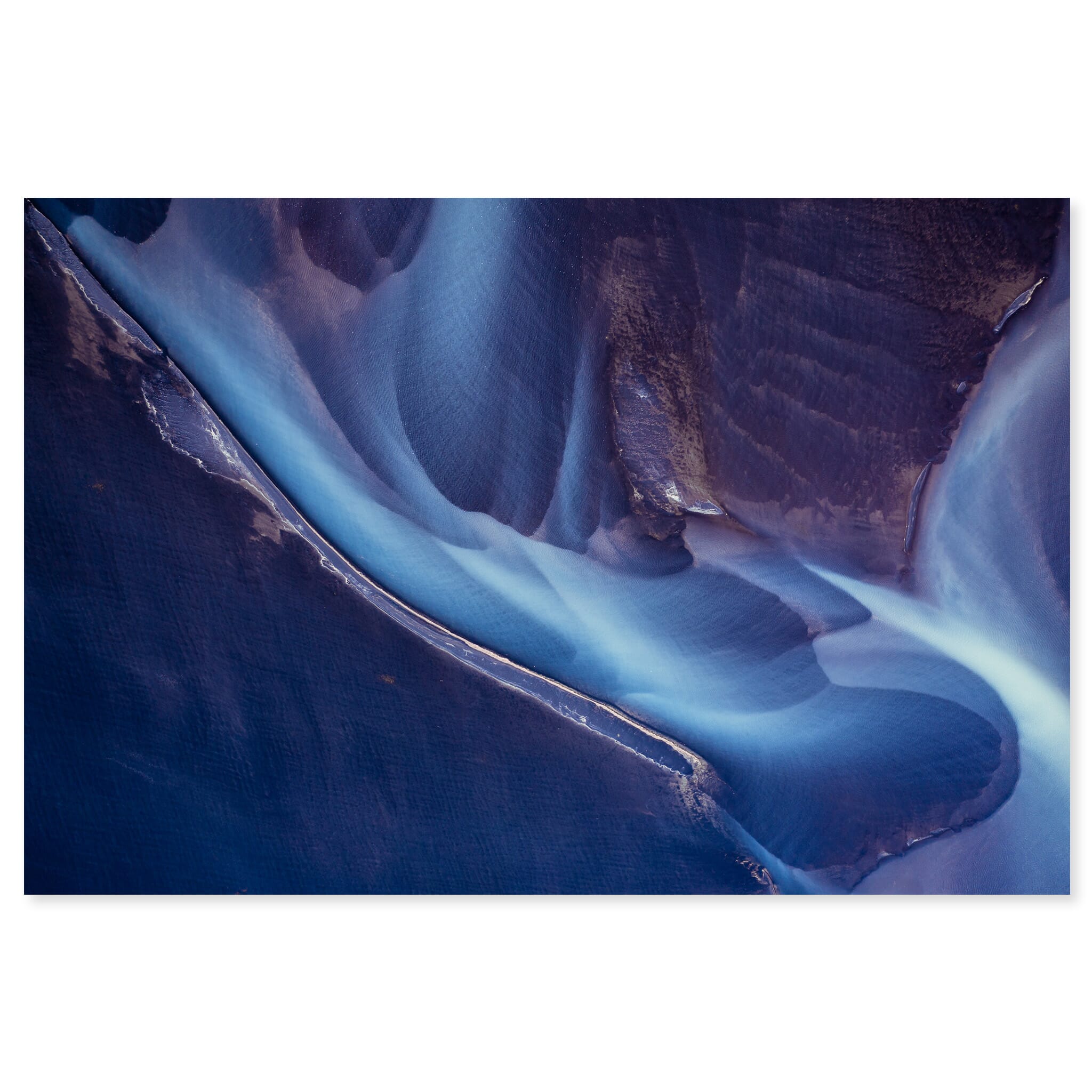 Fine art print of an arial glacial river in Iceland with subtle violet tones