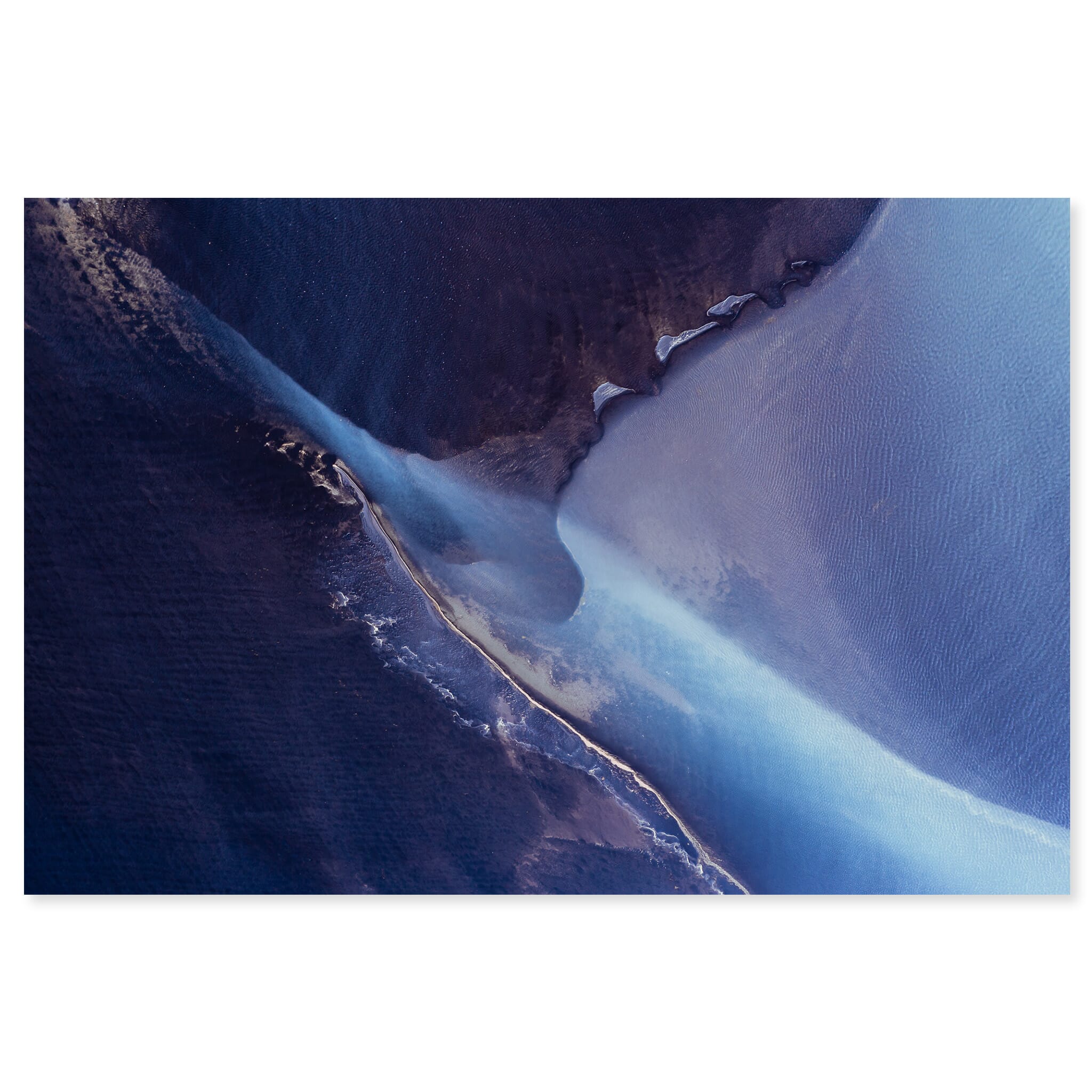 Fine art print of an aerial glacial river in Iceland with subtle violet hues