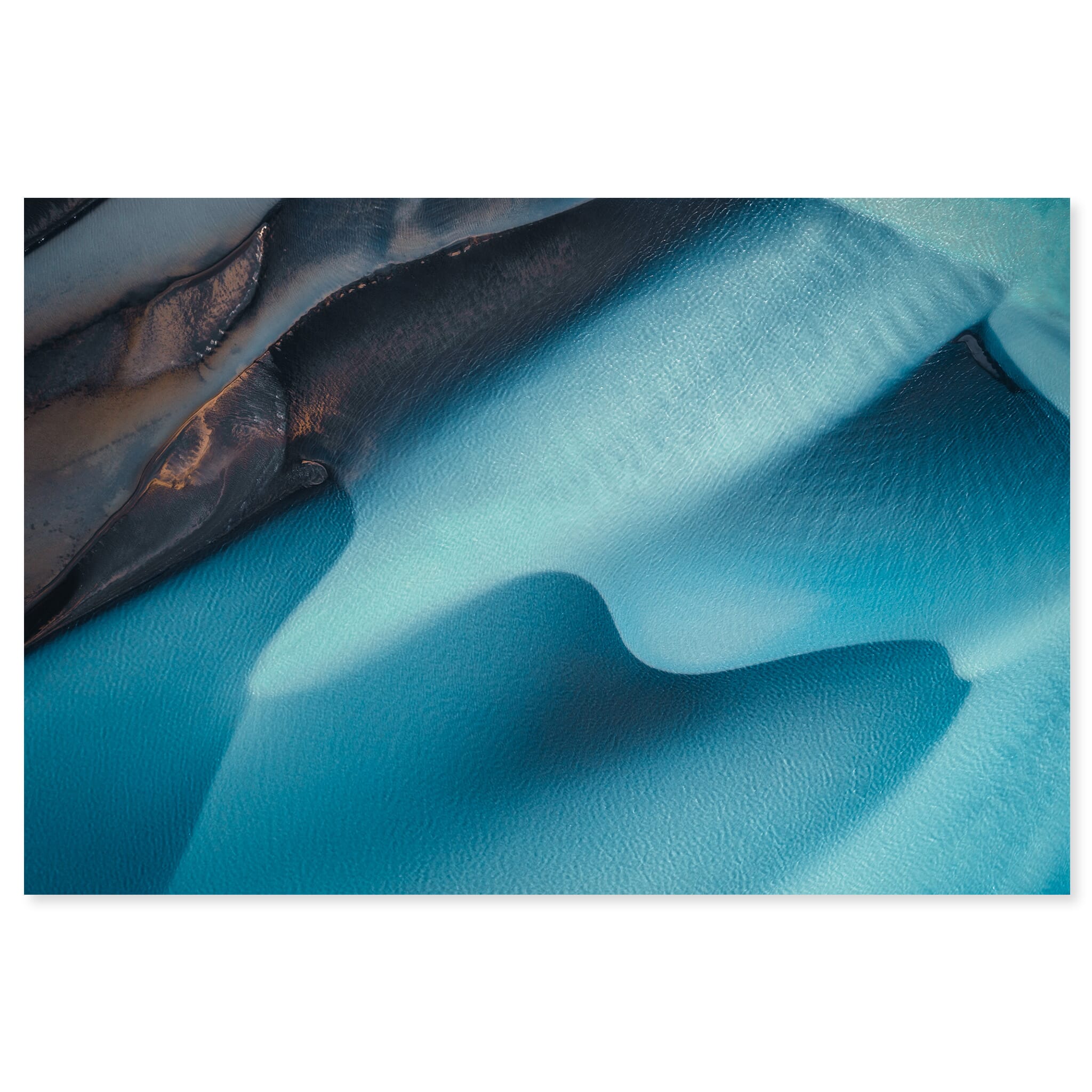 Fine art print of a glacial river in Iceland with bright turquoise and blue tones