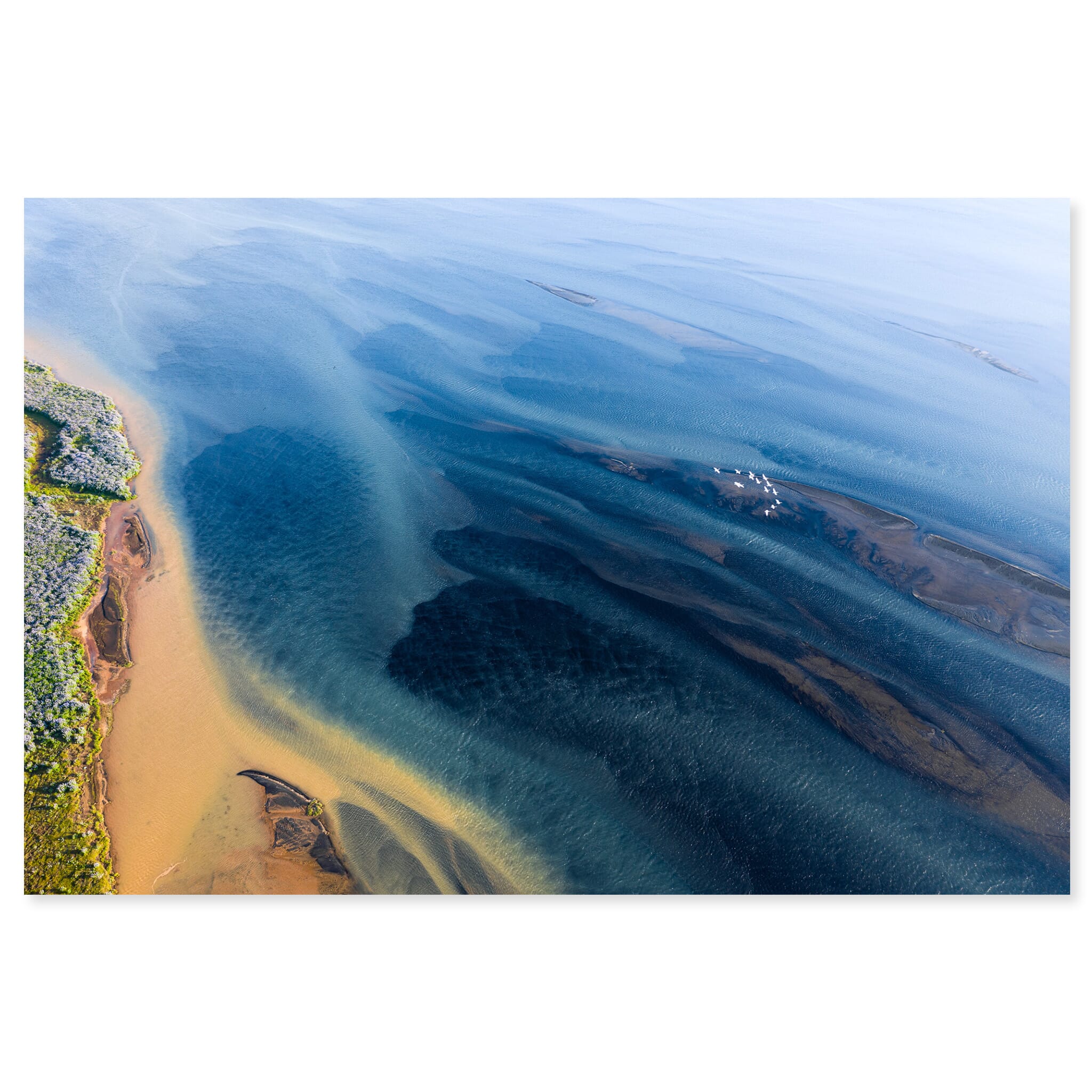 Fine art print of an aerial glacial river with bright summer colors in Iceland