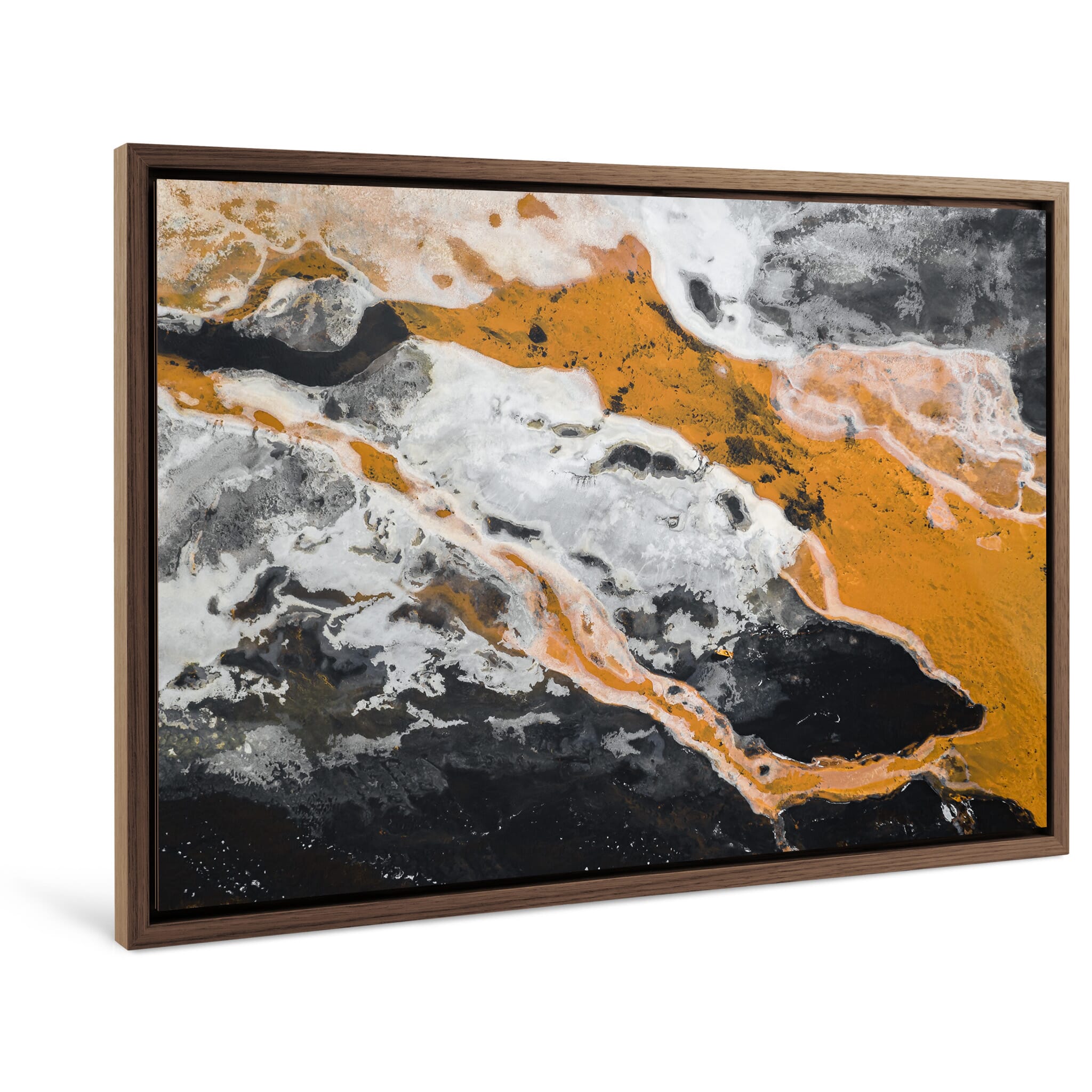 Framed photo print of contrasting snowy terrain and vibrant orange river channels