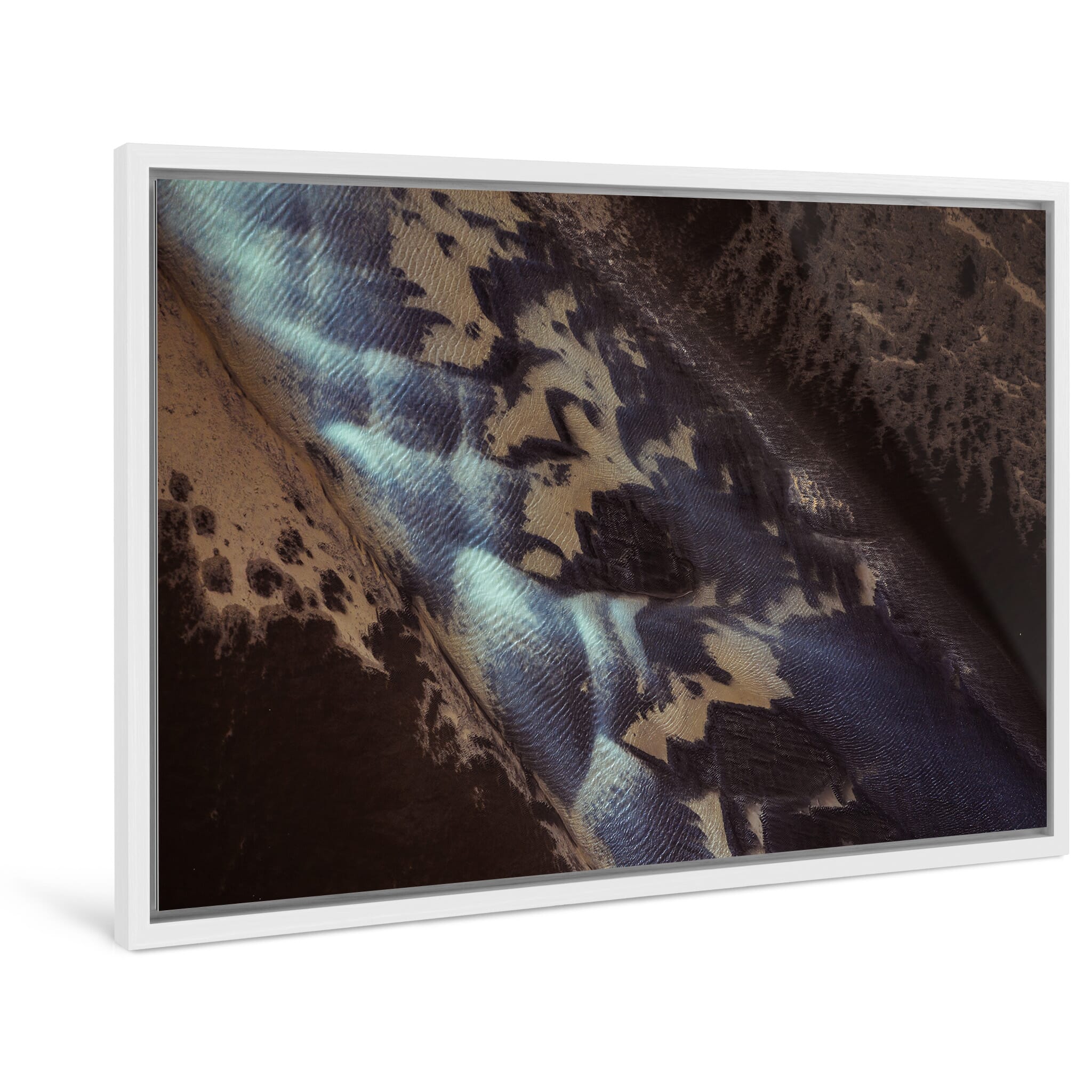 Framed photo print of dynamic sand formations shaped by water and motion