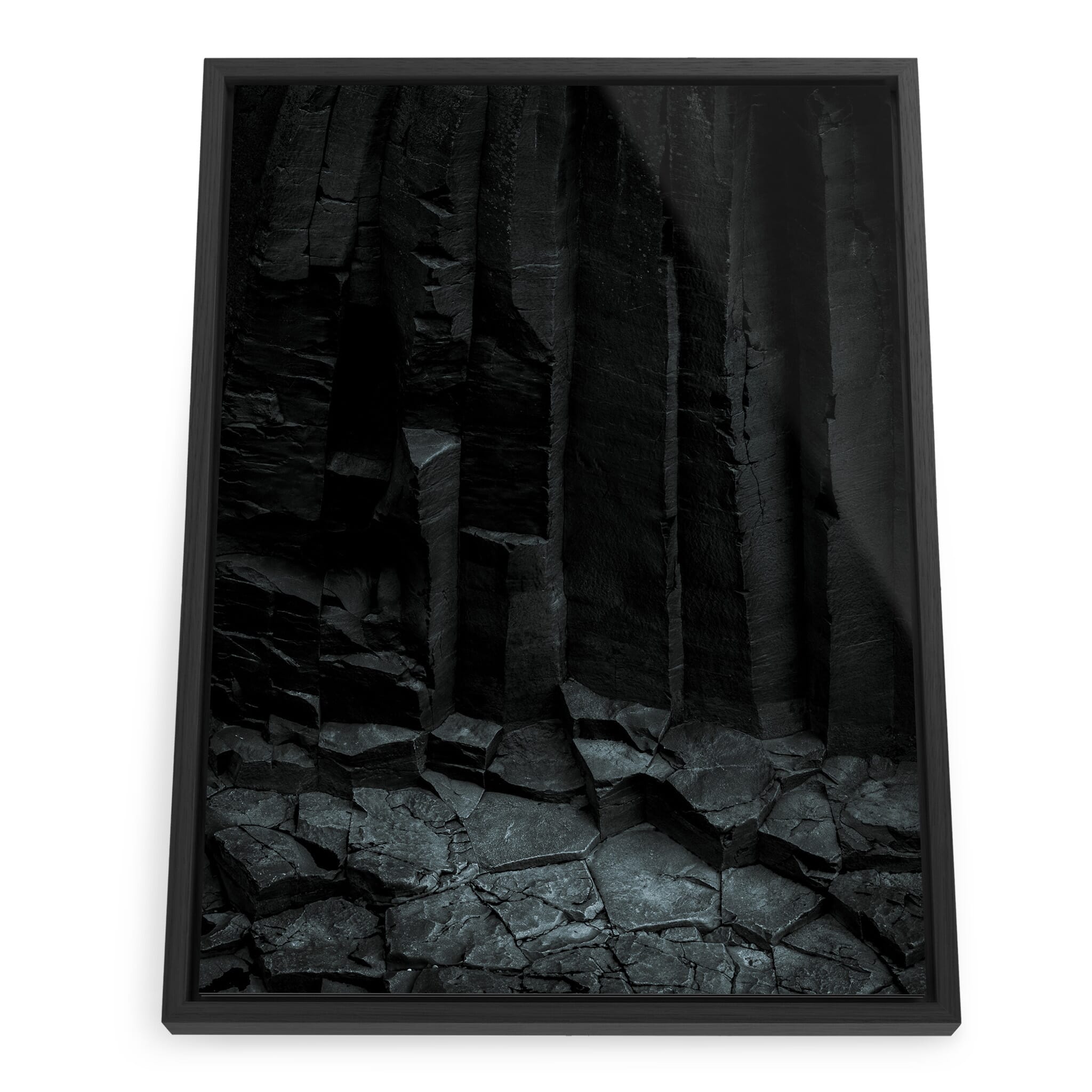 Framed photo print of geometric basalt columns in monochrome