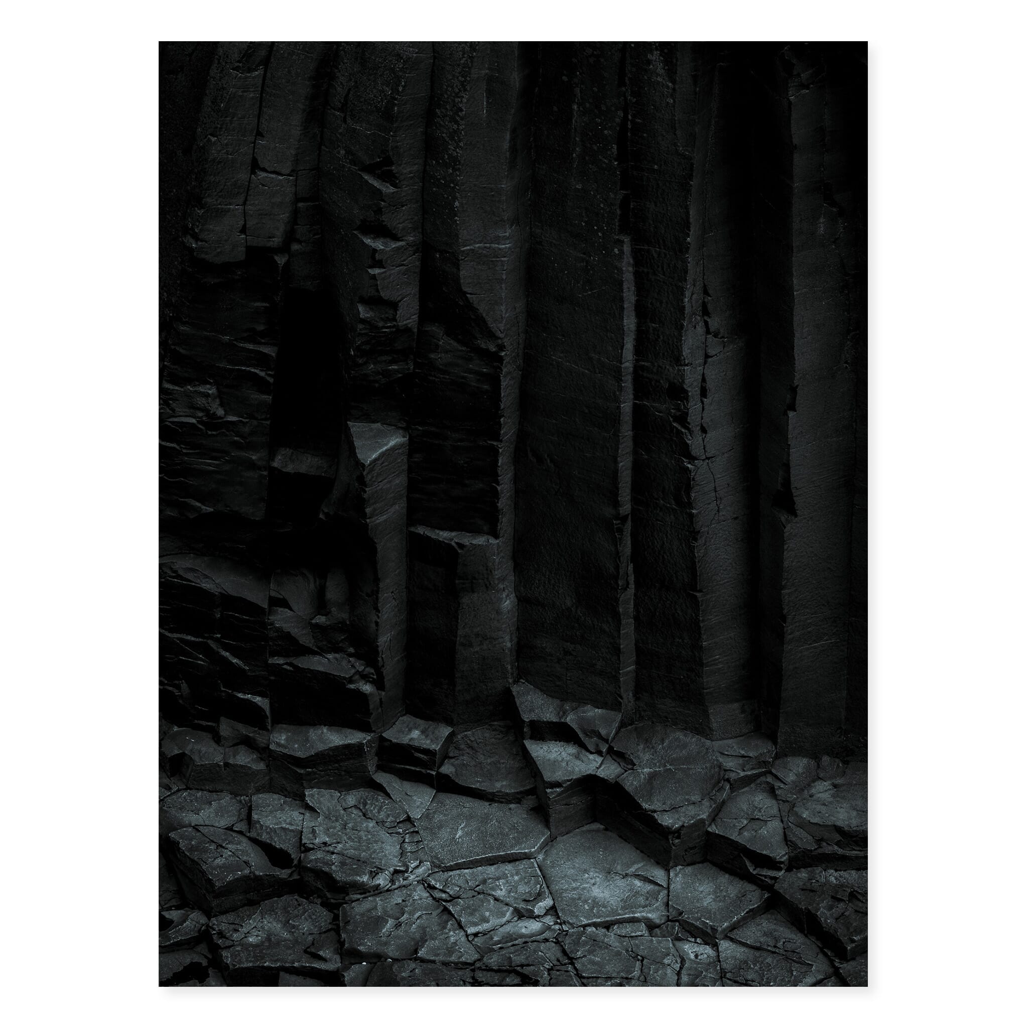 Fine art print of dark basalt formations in Iceland’s volcanic landscape