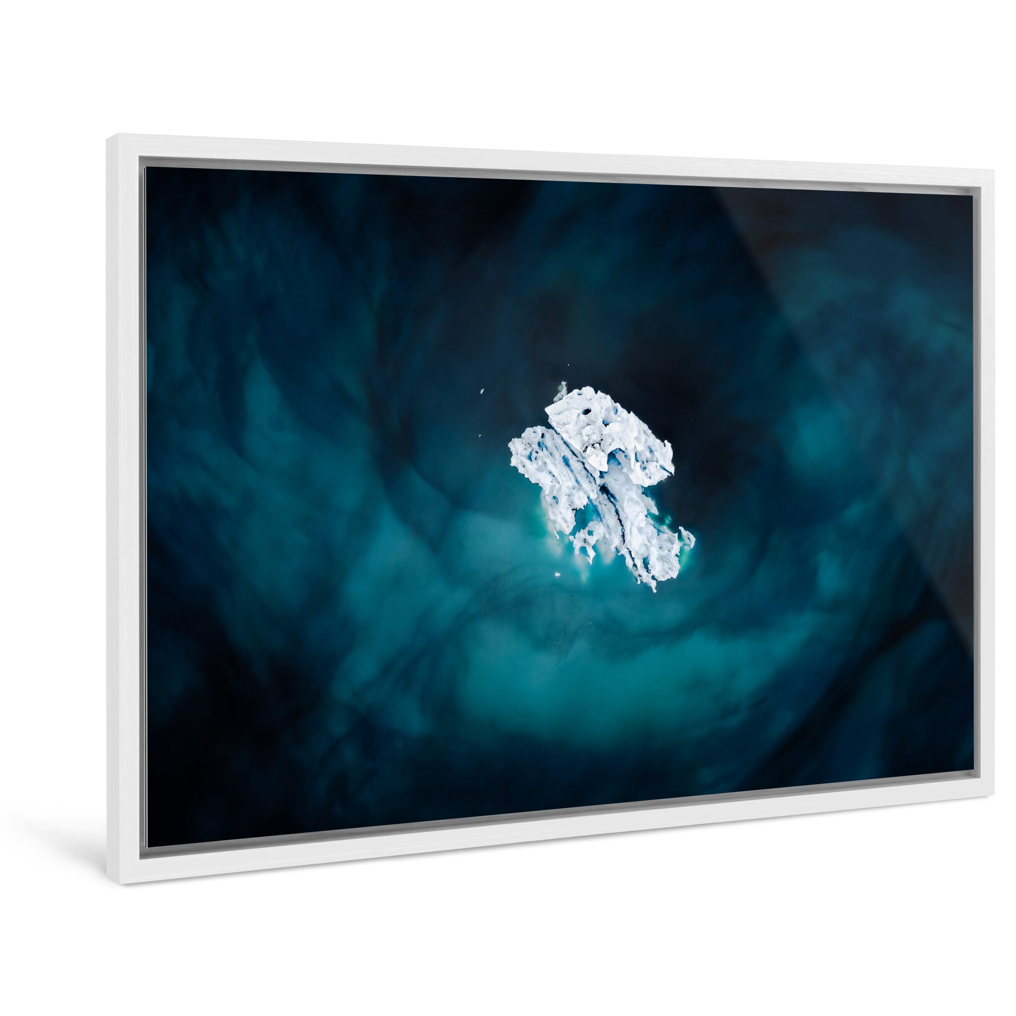 Framed photo print of floating iceberg with dark volcanic sand trails