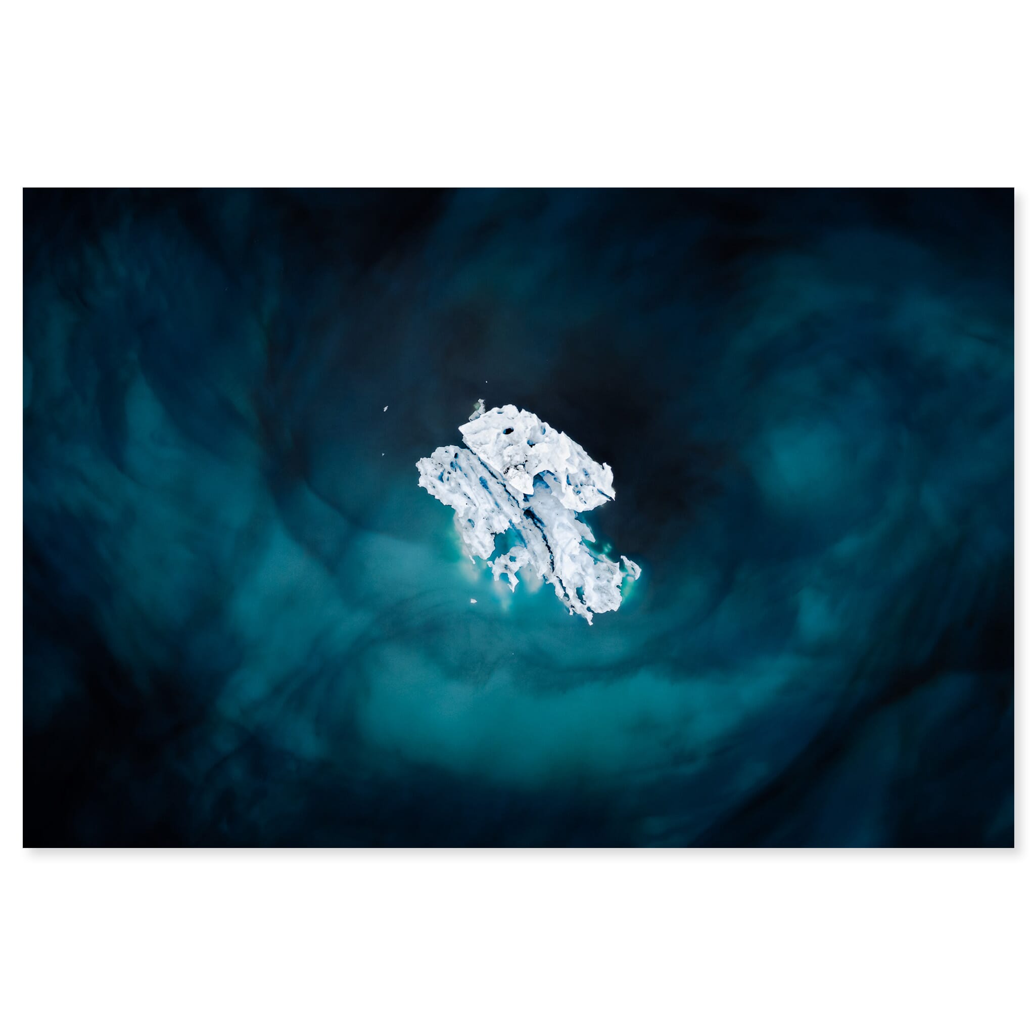 Fine art print of drifting iceberg in a blue glacial lagoon in Iceland