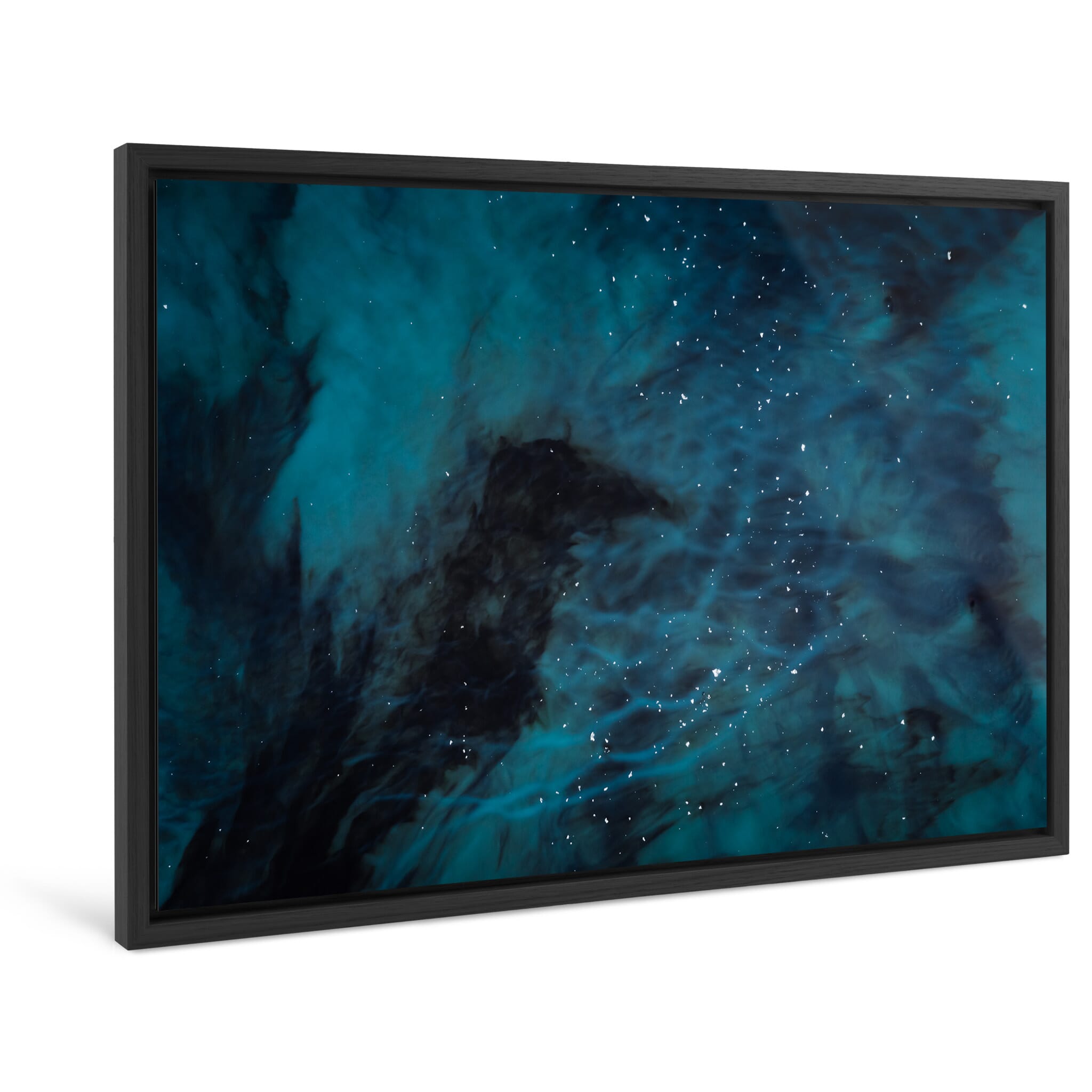 Framed photo print of dark volcanic sand swirling in deep blue water