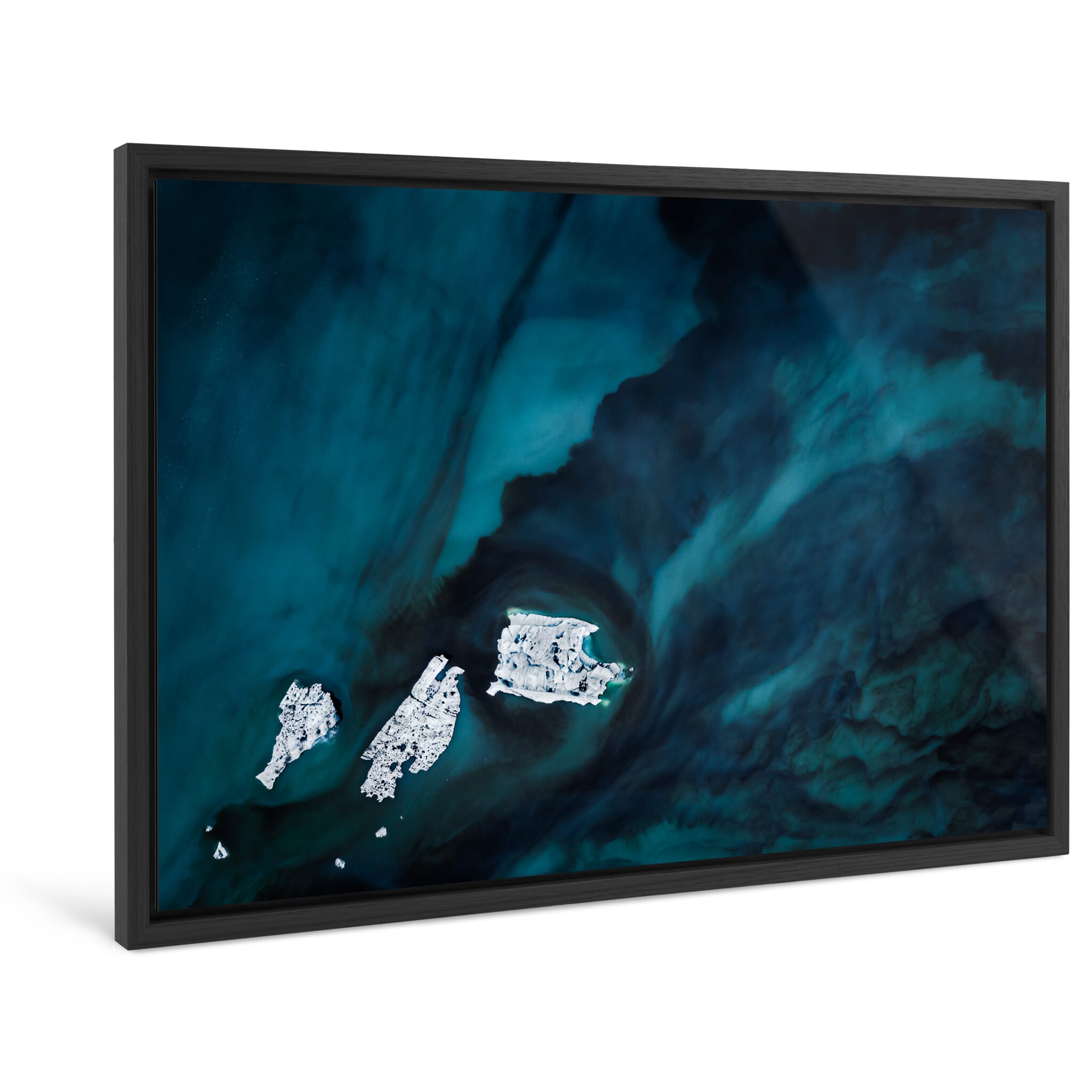 Framed photo print of floating icebergs shaped by wind and currents