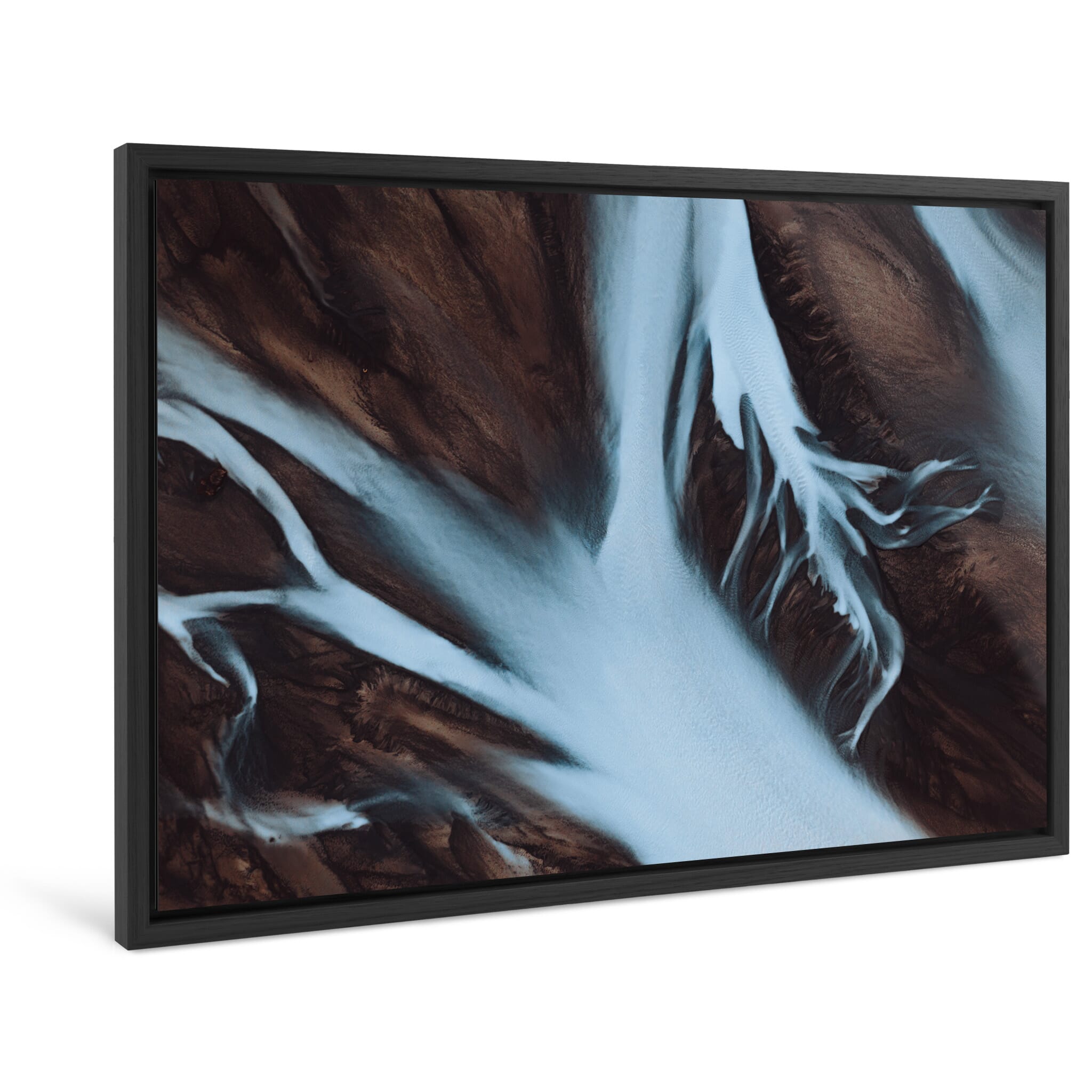 Framed photo print of aerial view of glacial river winding through dark terrain