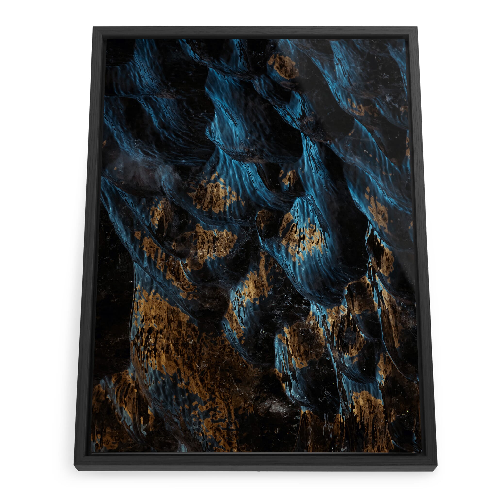 Framed photo print of black glacier ice with golden sunlight reflections