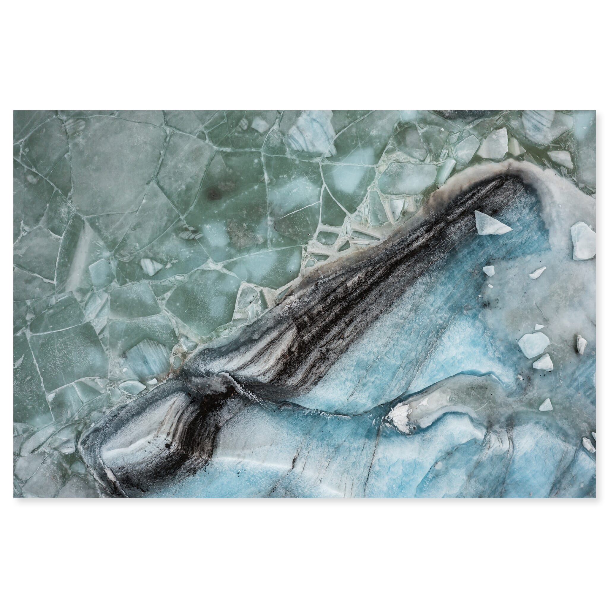 Fine art print of icebergs floating on a frozen glacial lagoon in Iceland