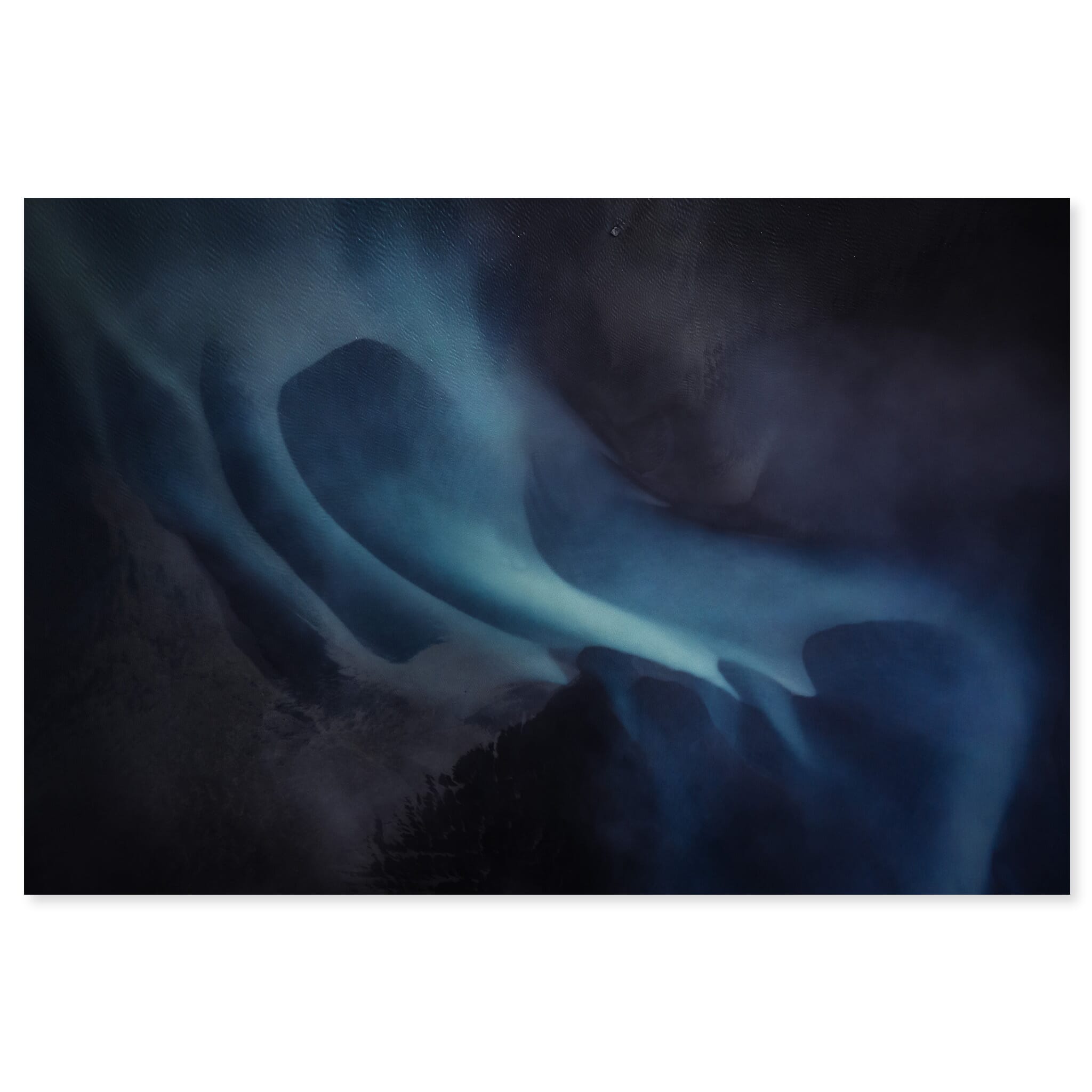 Fine art print of an aerial view of a dark glacier river at dusk in Iceland