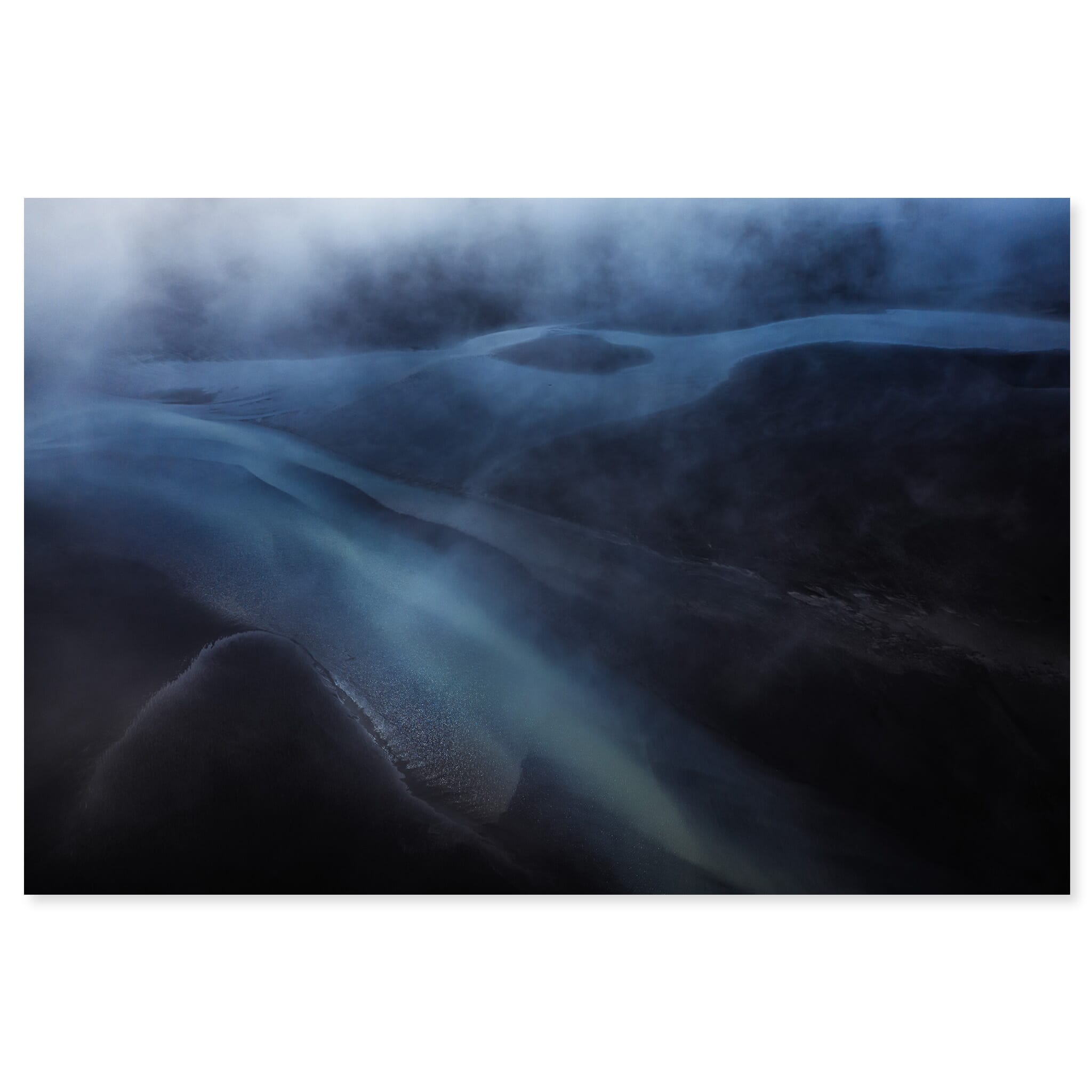 Fine art print of an aerial glacier river in Iceland under dark moody clouds