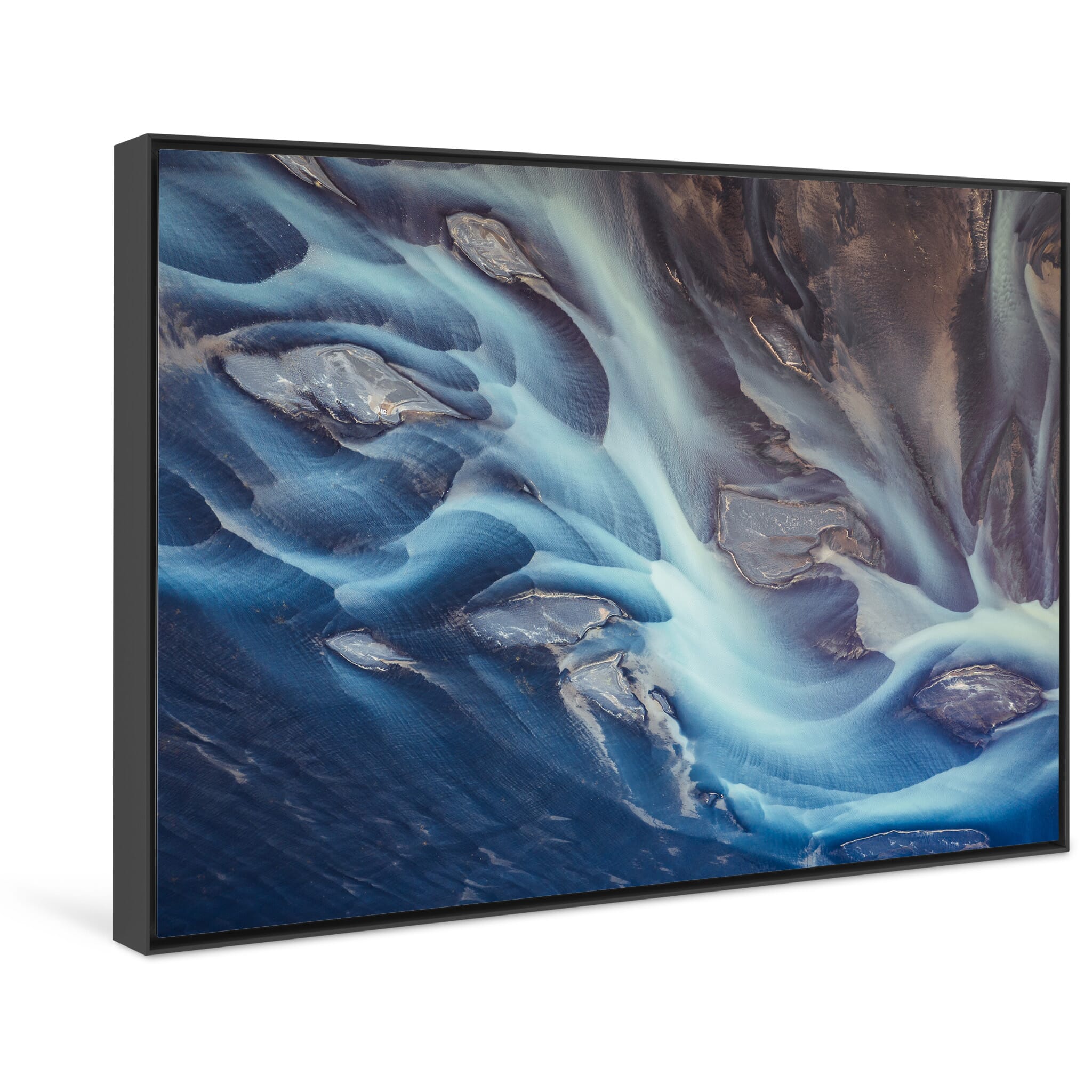 Framed photo print of vibrant blue waterways and braided textures shaped by glacier runoff