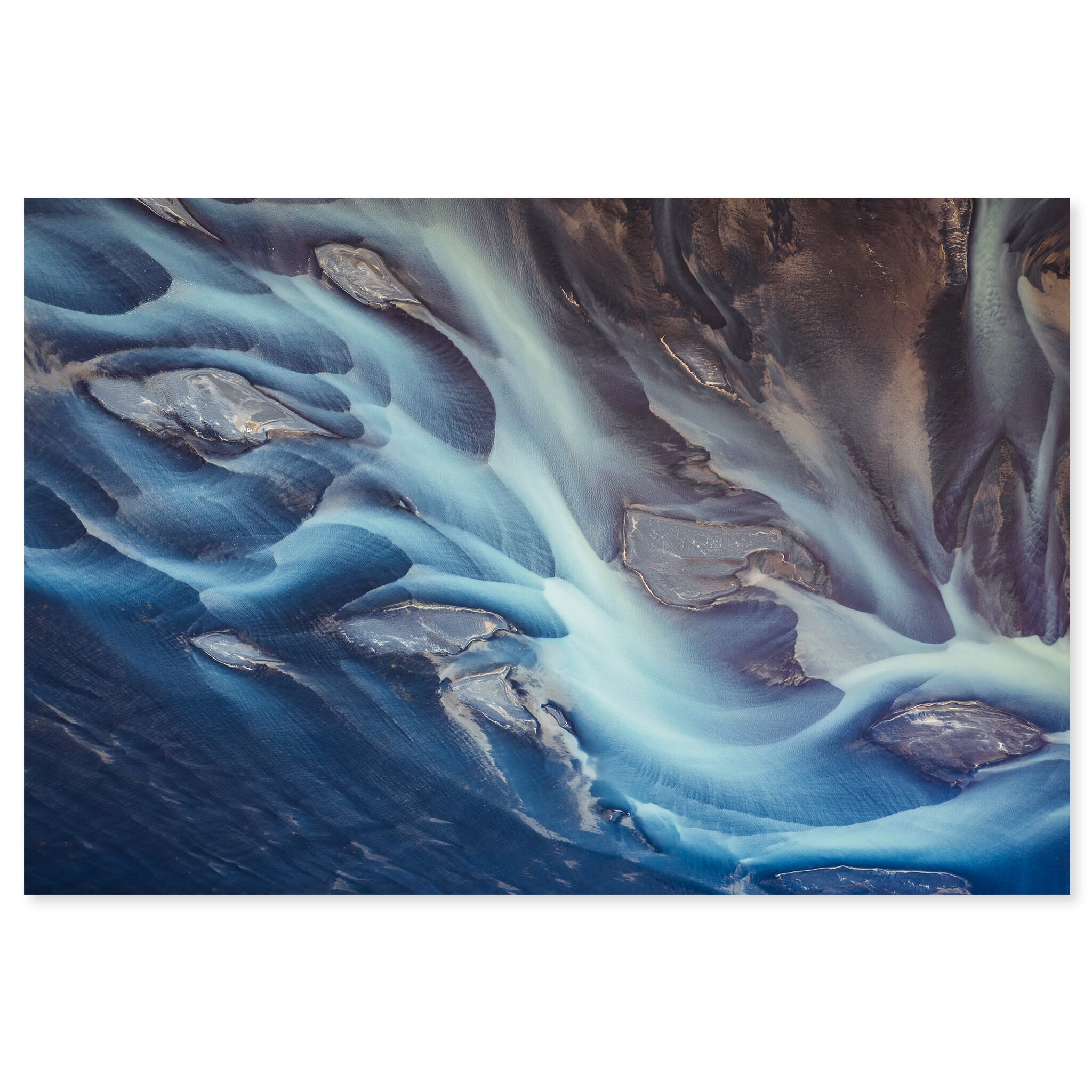 Fine art print of braided glacial river system with blue tones and sandbars in Iceland