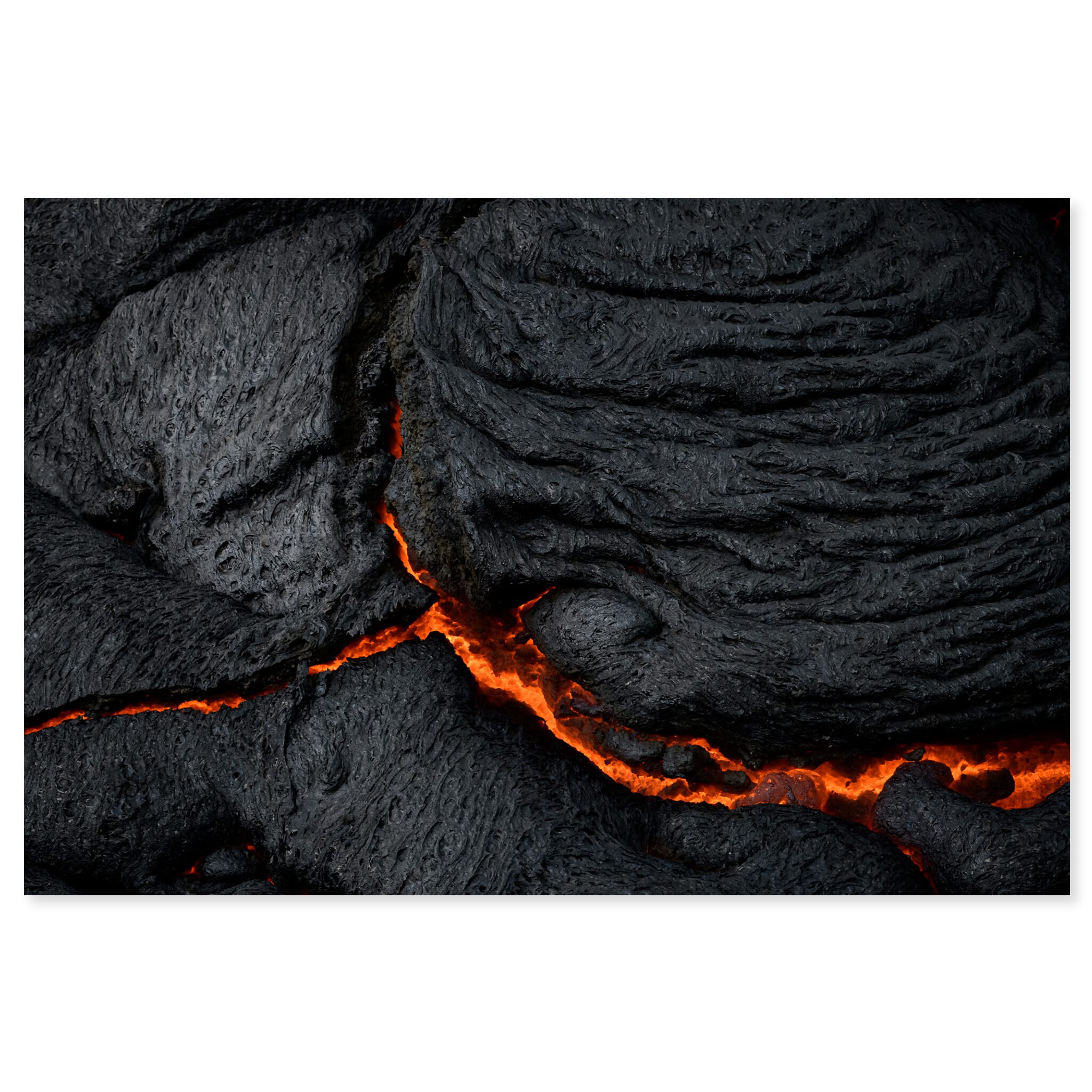 Fine art print of glowing volcanic lava with deep fissures in Iceland