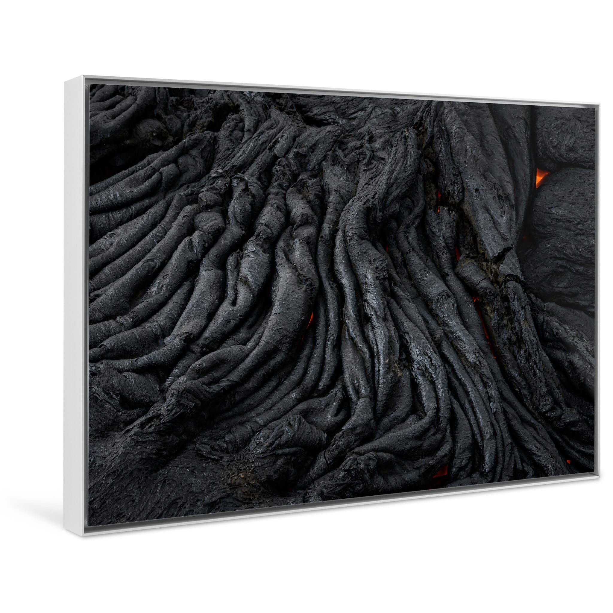 Framed photo print of black volcanic textures shaped by cooling and erosion
