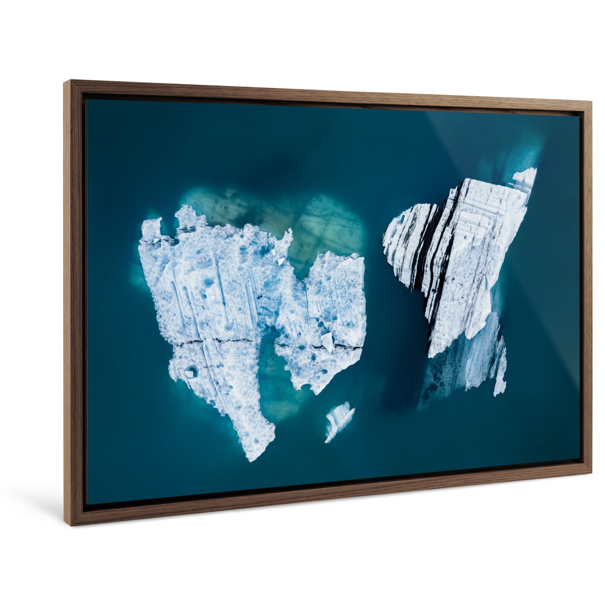 Framed photo print of bright water contrasting with eroded ice shaped by natural forces