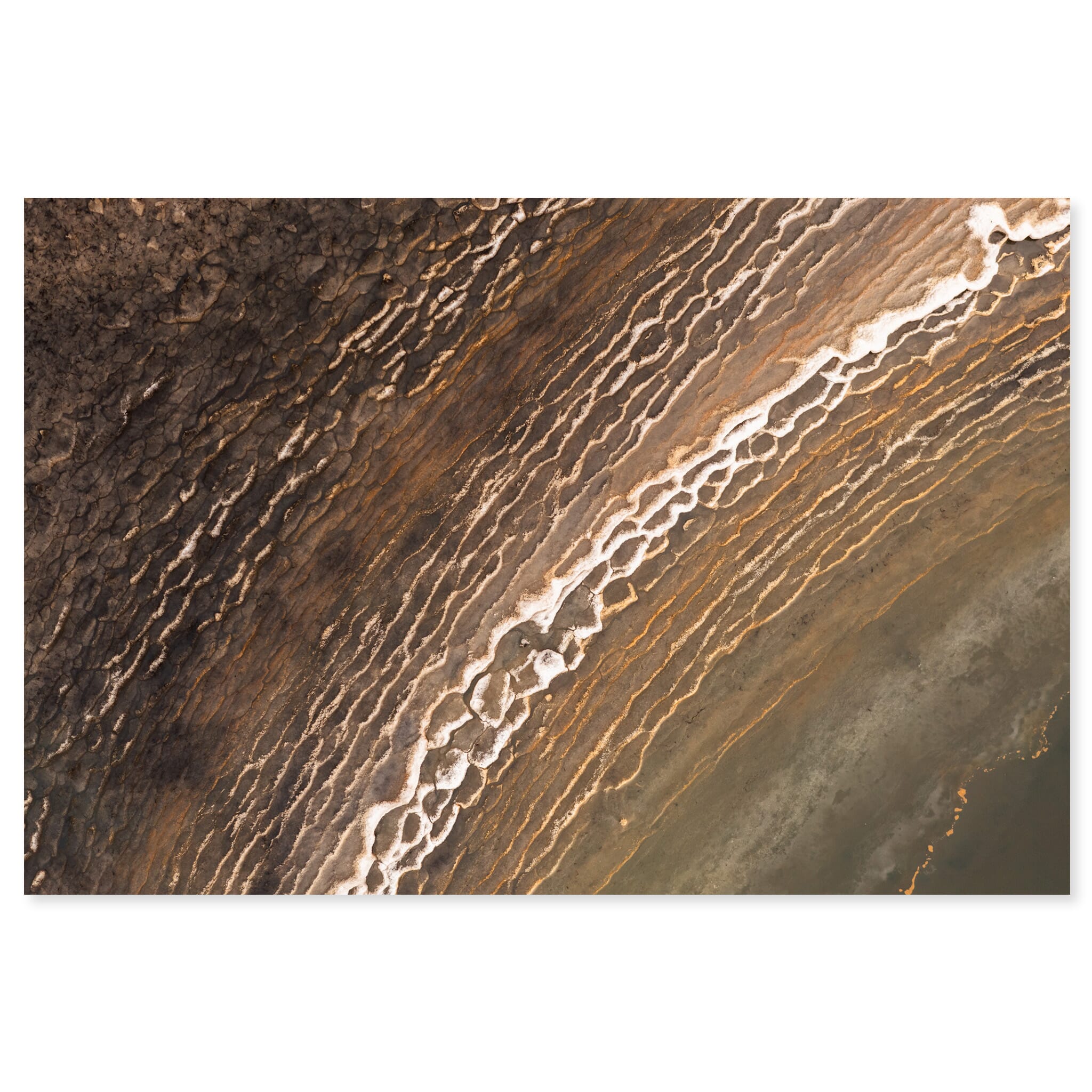 Fine art print of frozen pools with abstract patterns seen from above