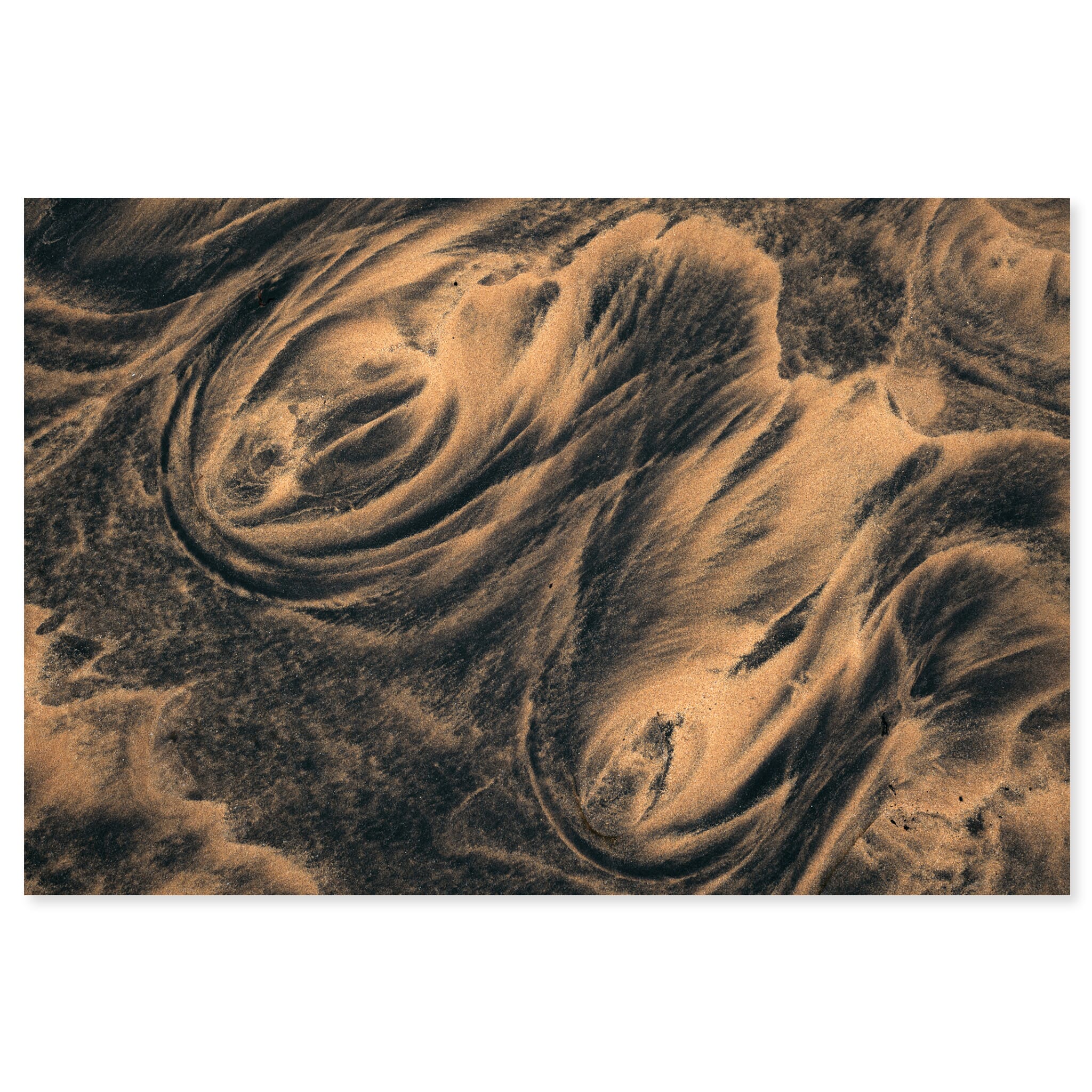 Fine art print of wave-shaped sand forms with dark and bright tones in Iceland