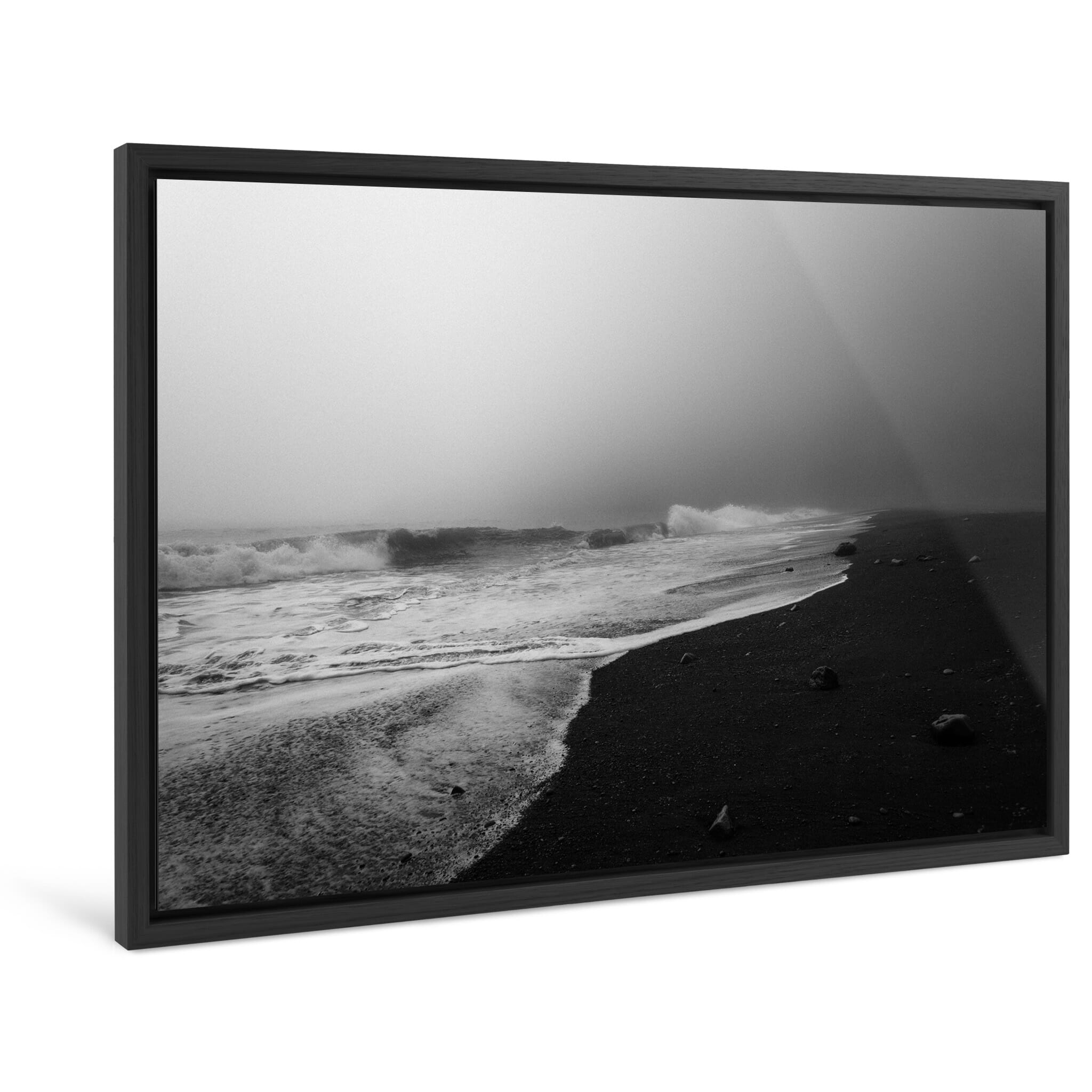 Framed photo print of misty seascape with dark volcanic sand and rhythmic waves