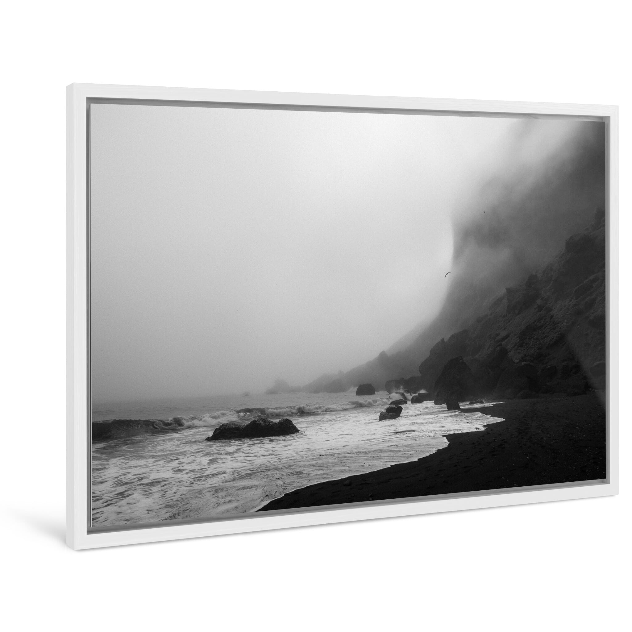 Framed photo print of quiet volcanic beach where cliffs meet waves in low visibility