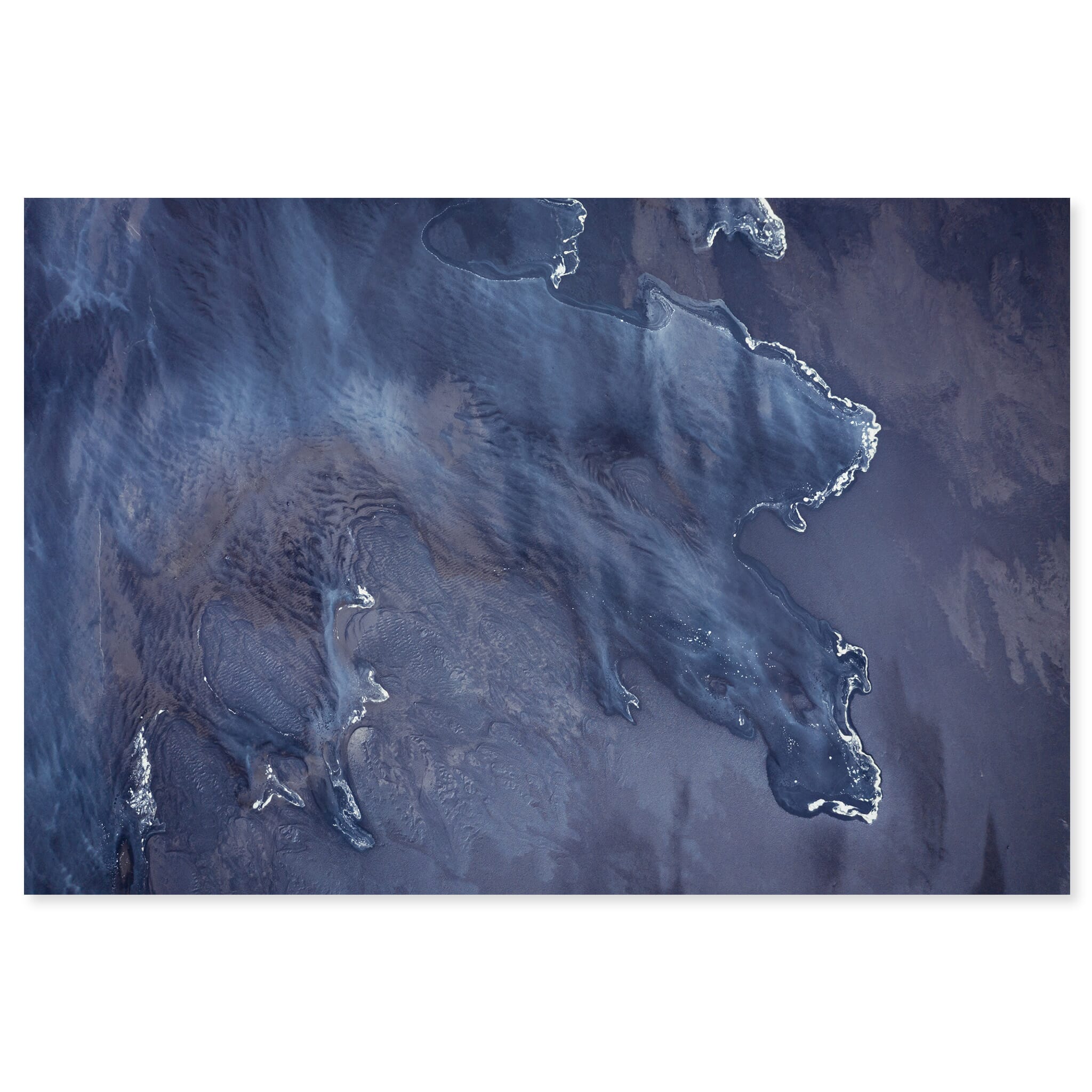 Fine art print of an incoming tide merging with glacial sediment on an Icelandic beach