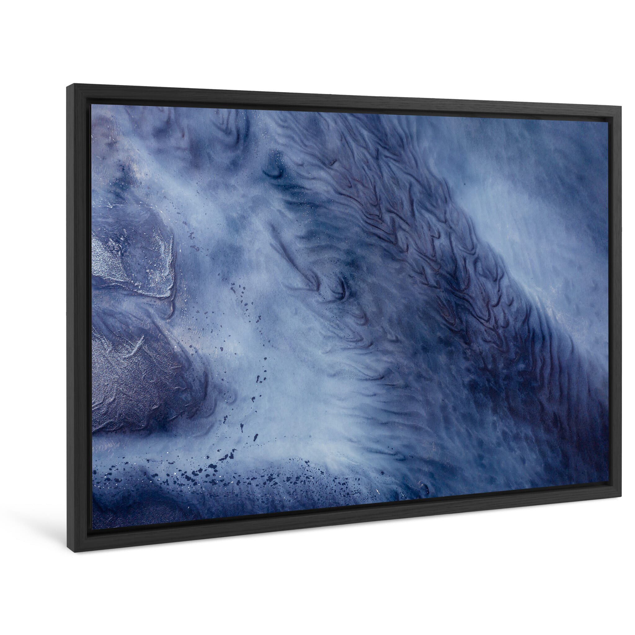 Framed photo print of tidal flows merging with glacial sediment on a black beach