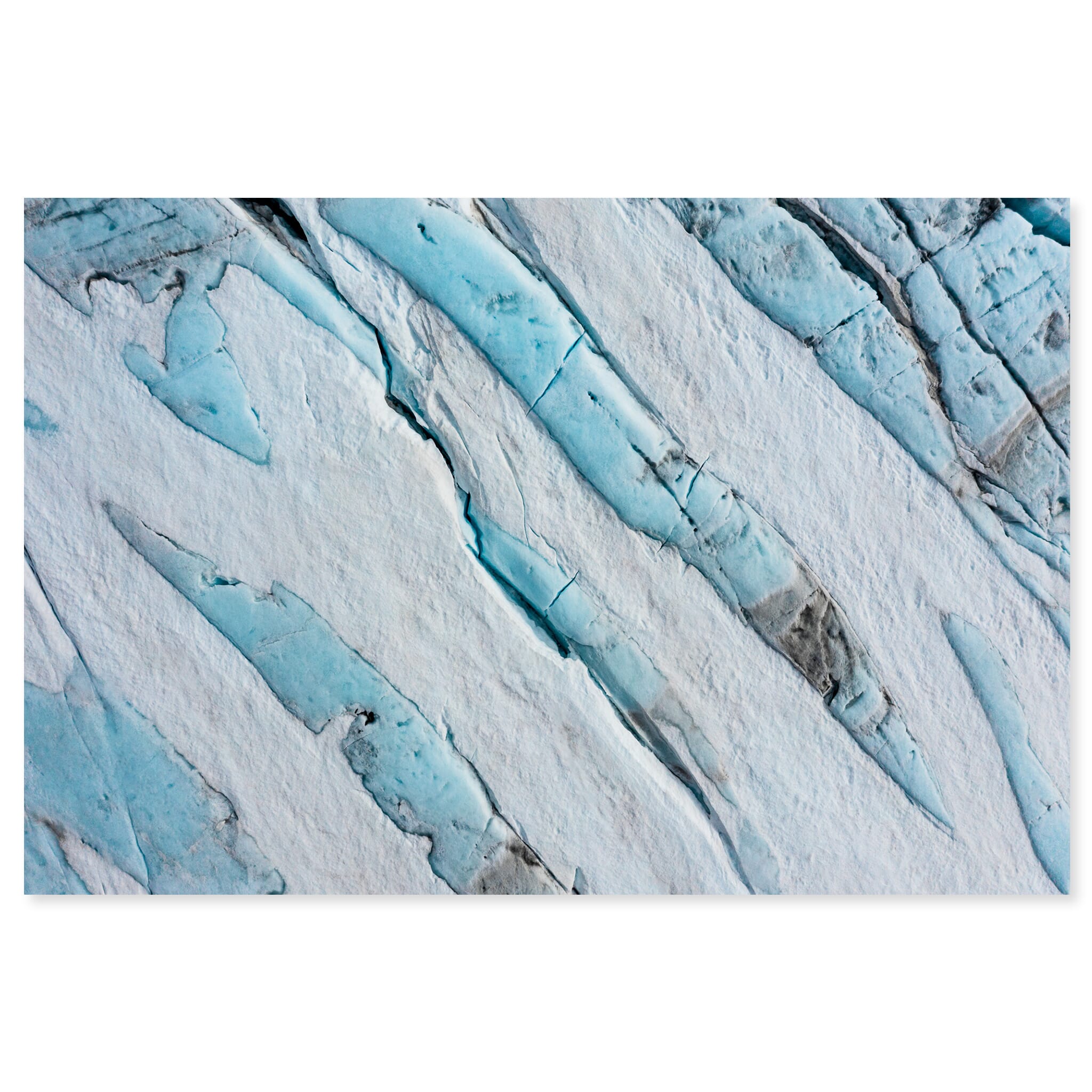 Fine art print of aerial view of glowing blue crevasses in a glacier landscape