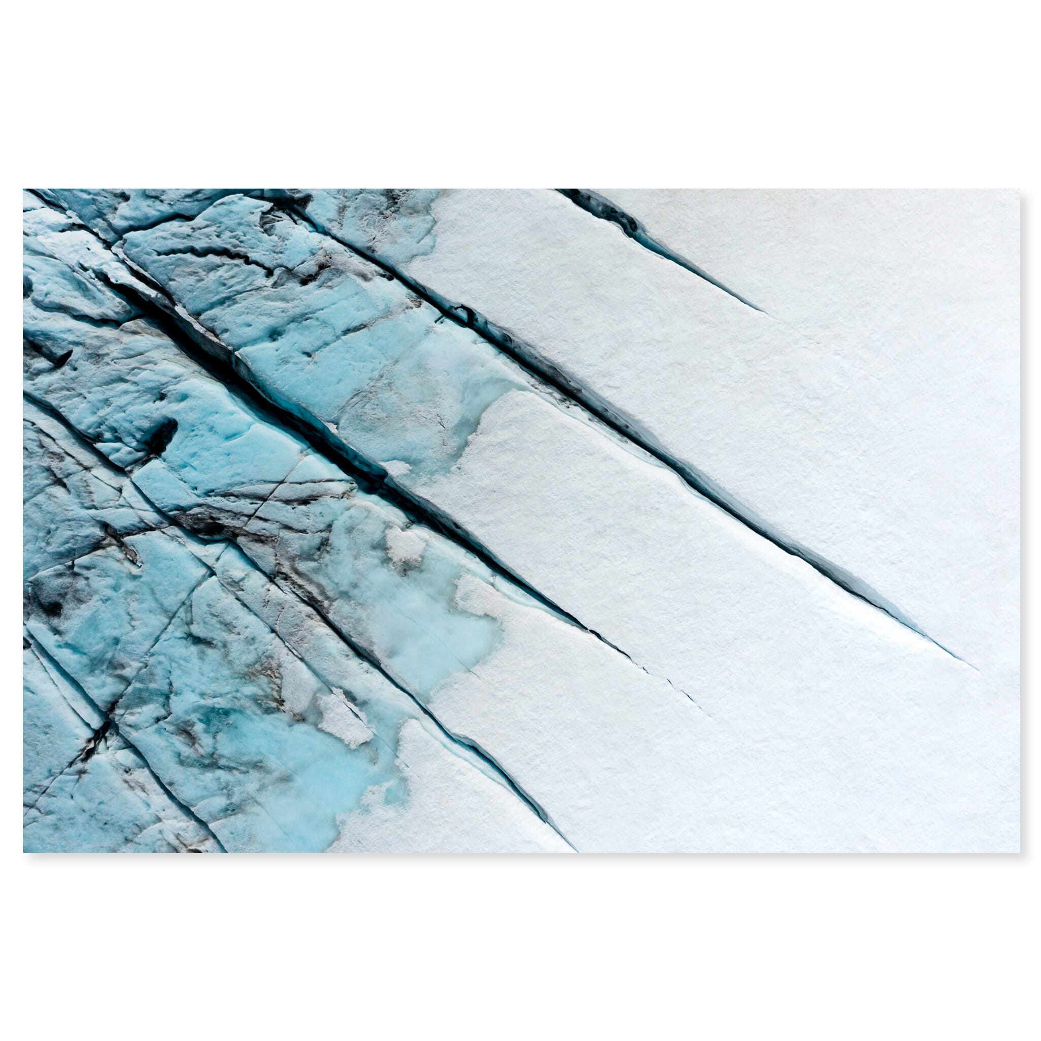 Fine art print of aerial view of glowing blue crevasses in a glacier landscape in Norway