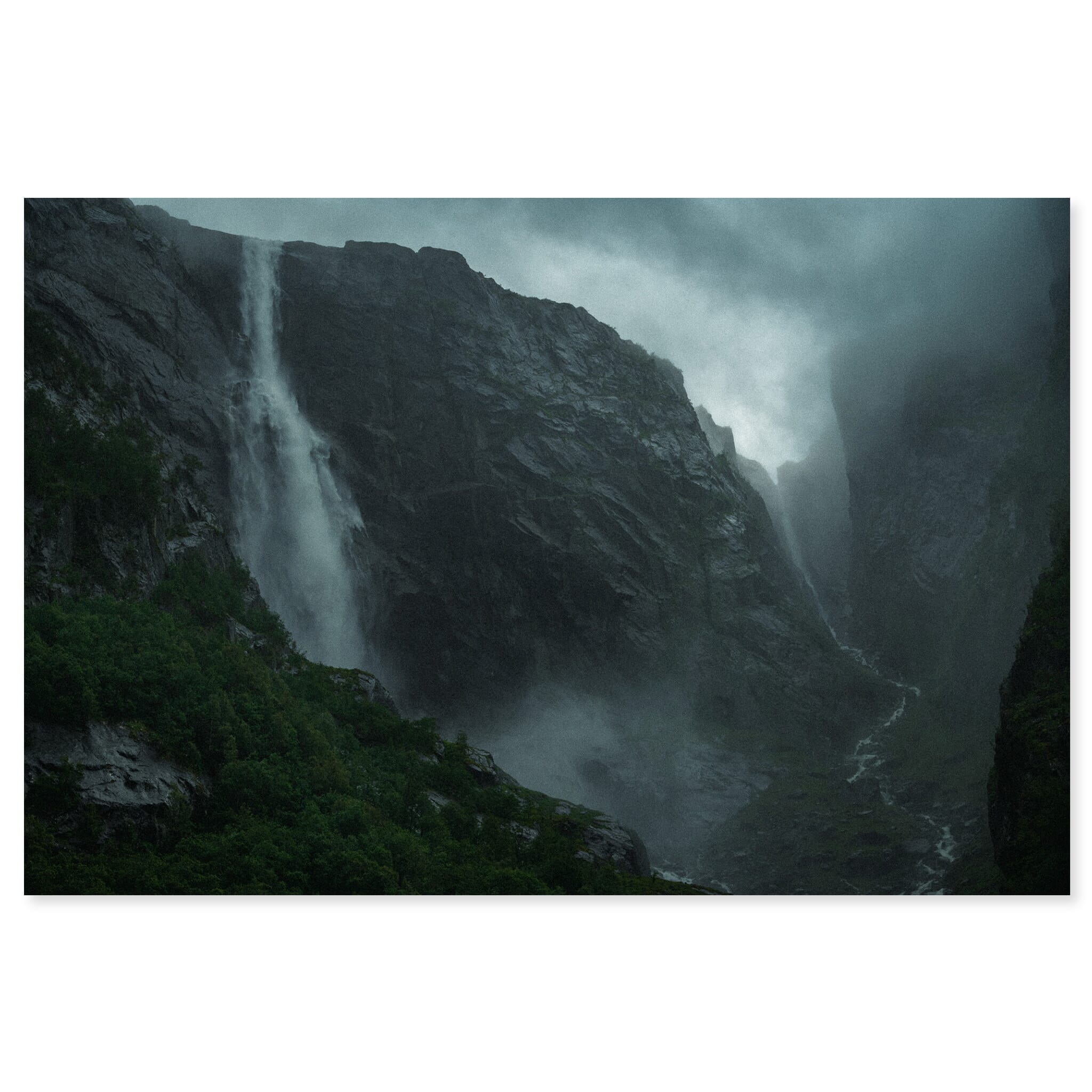 Fine art print of dark waterfall landscape with steep cliffs and soft light