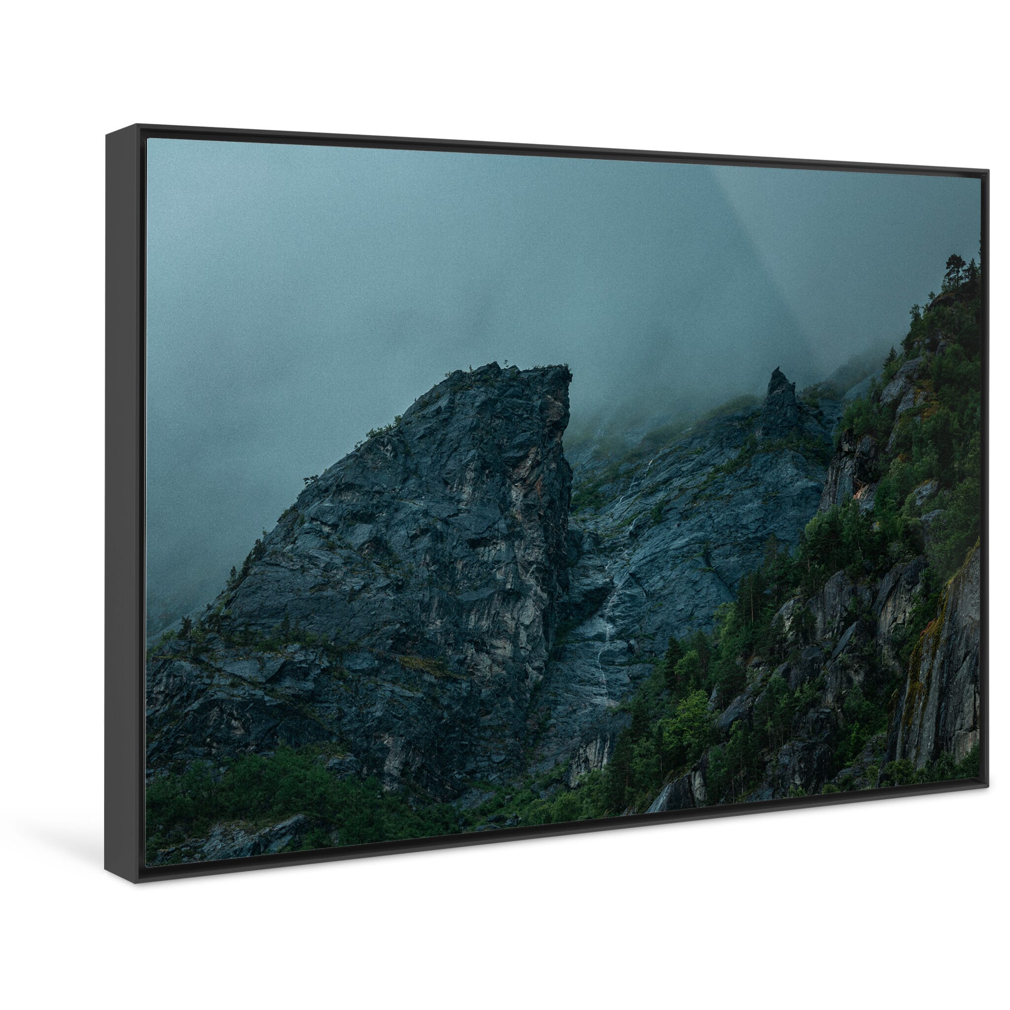 Framed photo print of somber coastal terrain with steep and rugged slopes